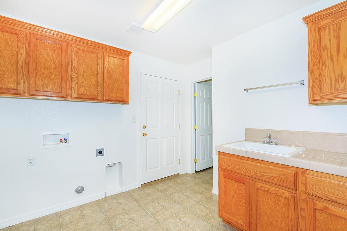 a kitchen with a sink and a refrigerator