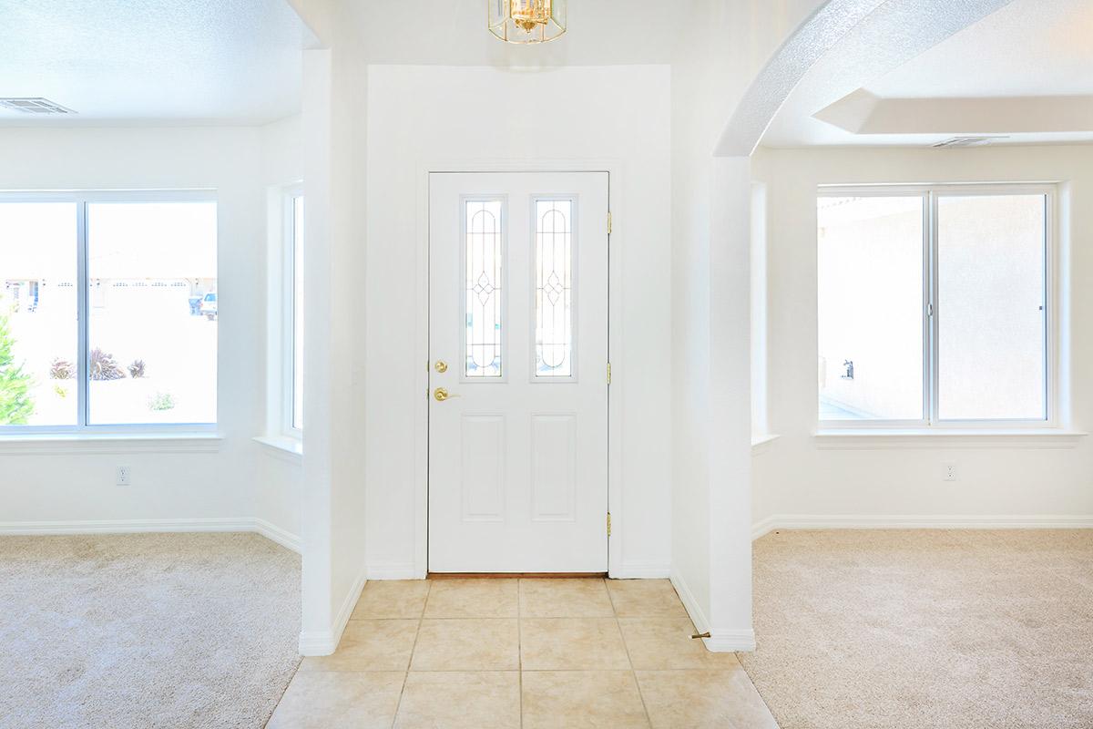 a large white tub next to a window