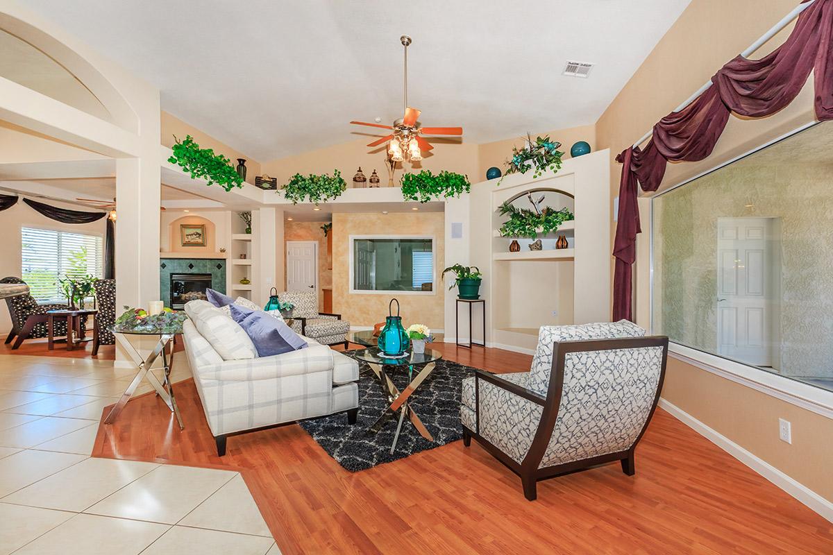 a living room filled with furniture and a fireplace