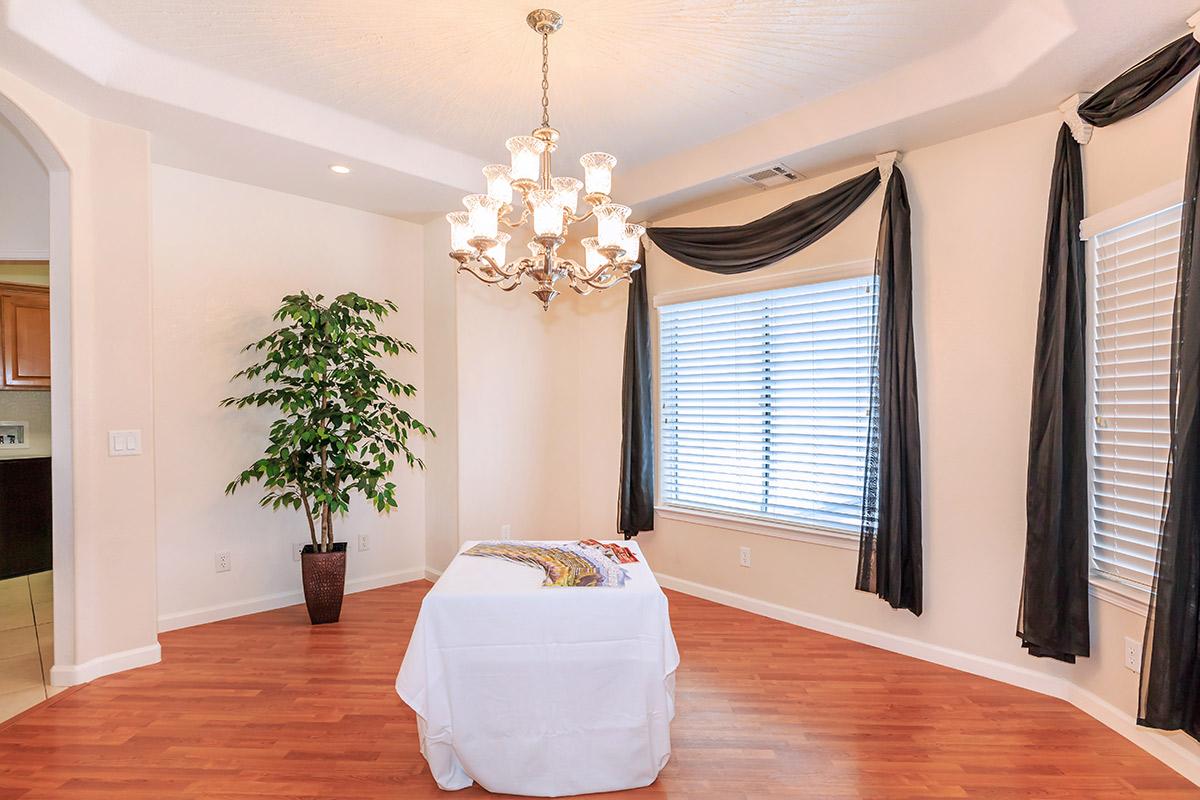 a living room filled with furniture and a fire place