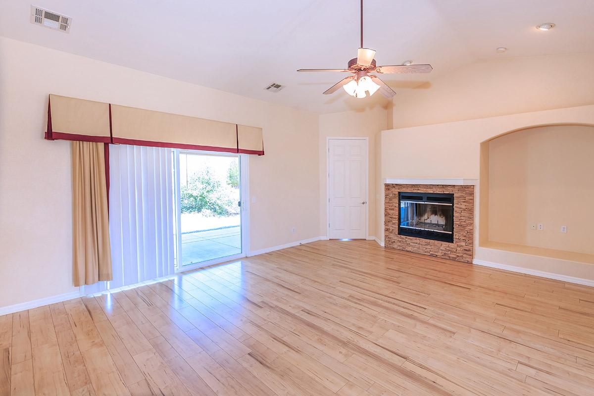 a living room with a hard wood floor