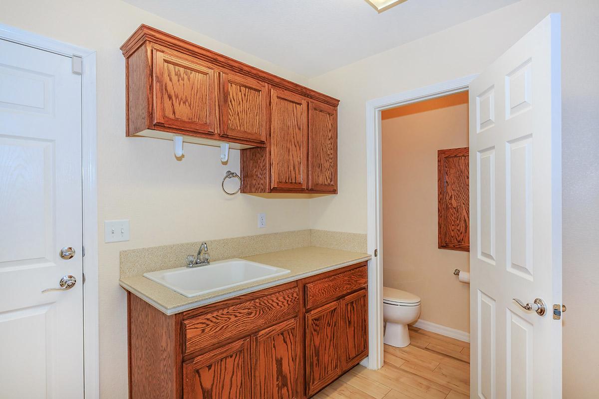 a kitchen with a sink and a mirror