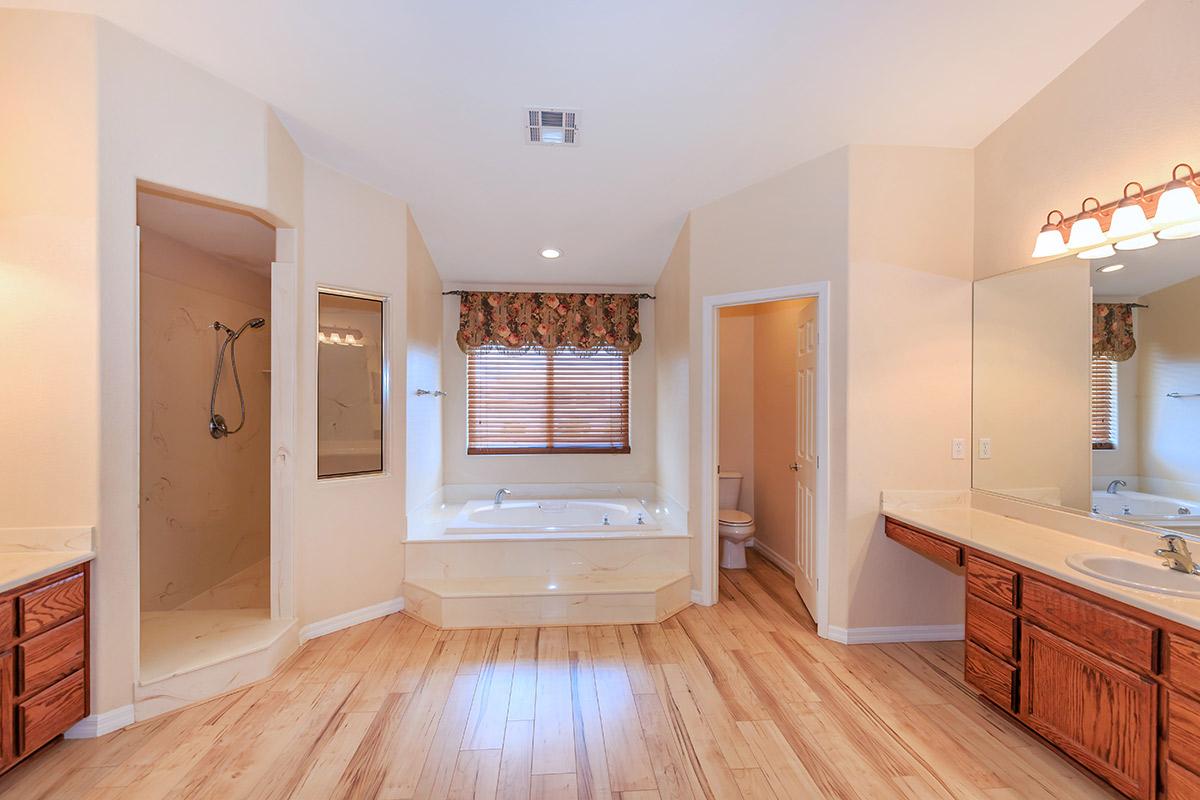 a kitchen with a hard wood floor