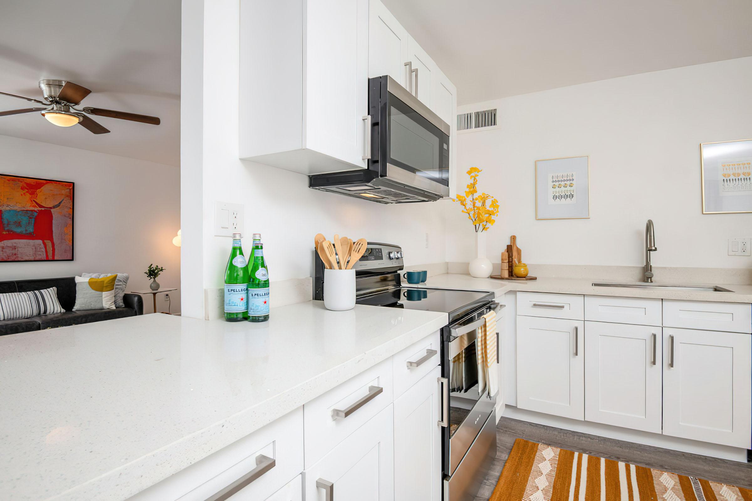 a kitchen with a sink and a refrigerator