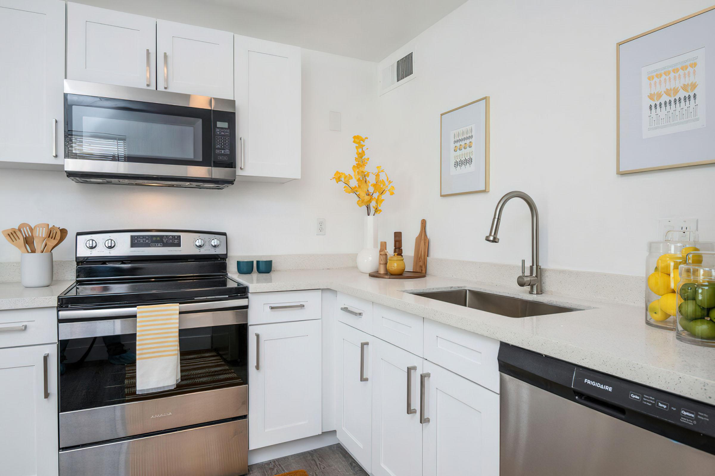 a kitchen with a sink and a microwave