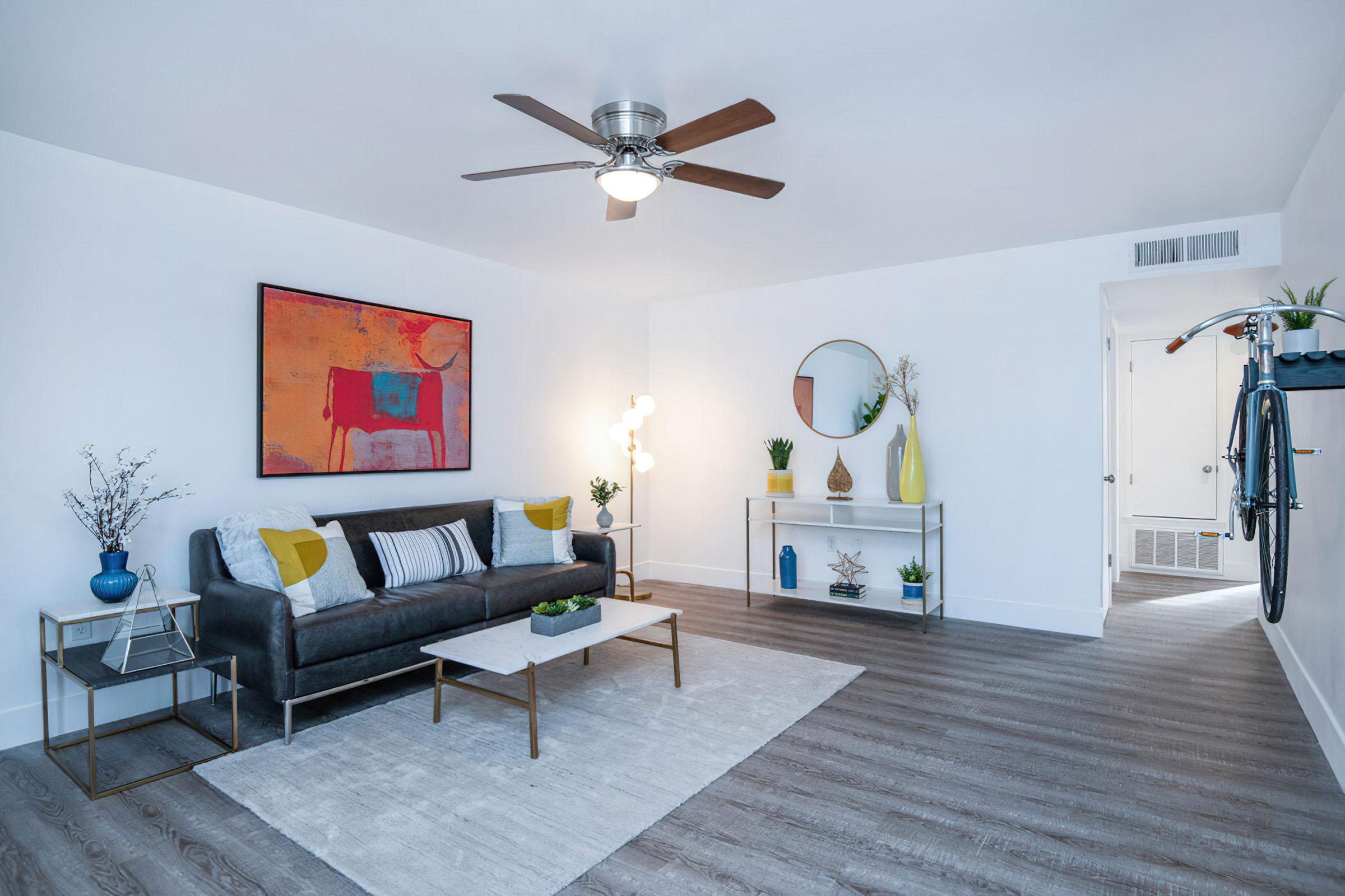 a living room filled with furniture and a fireplace