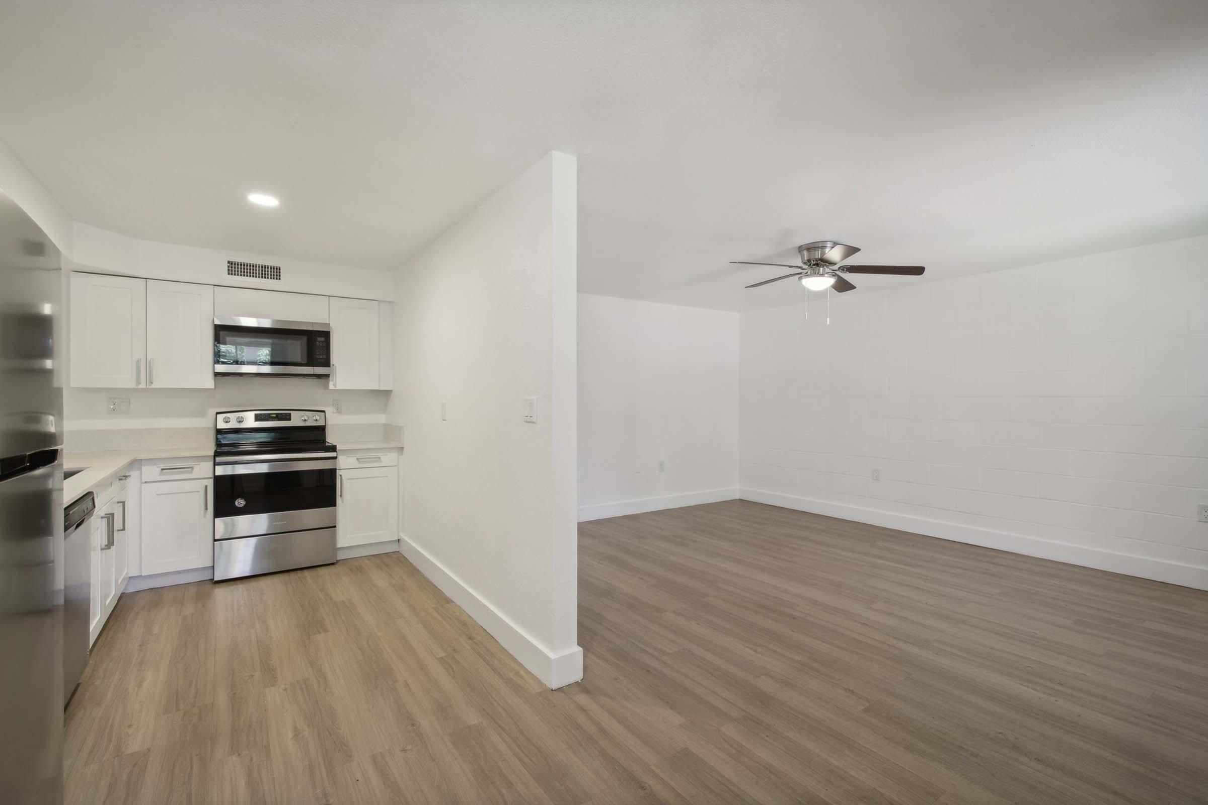 a kitchen with a wood floor