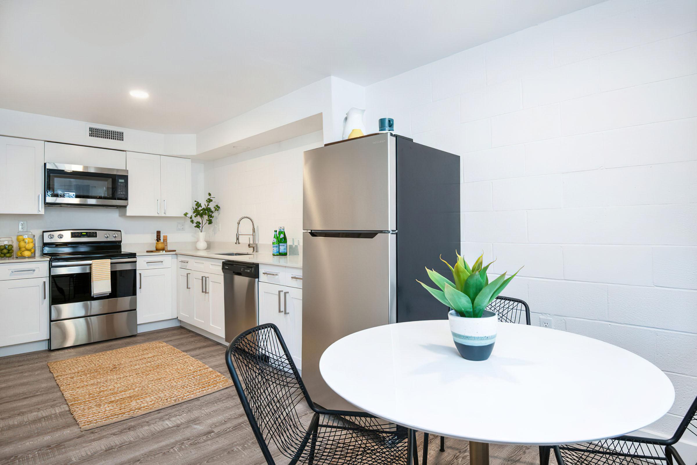 a kitchen with a table in a room