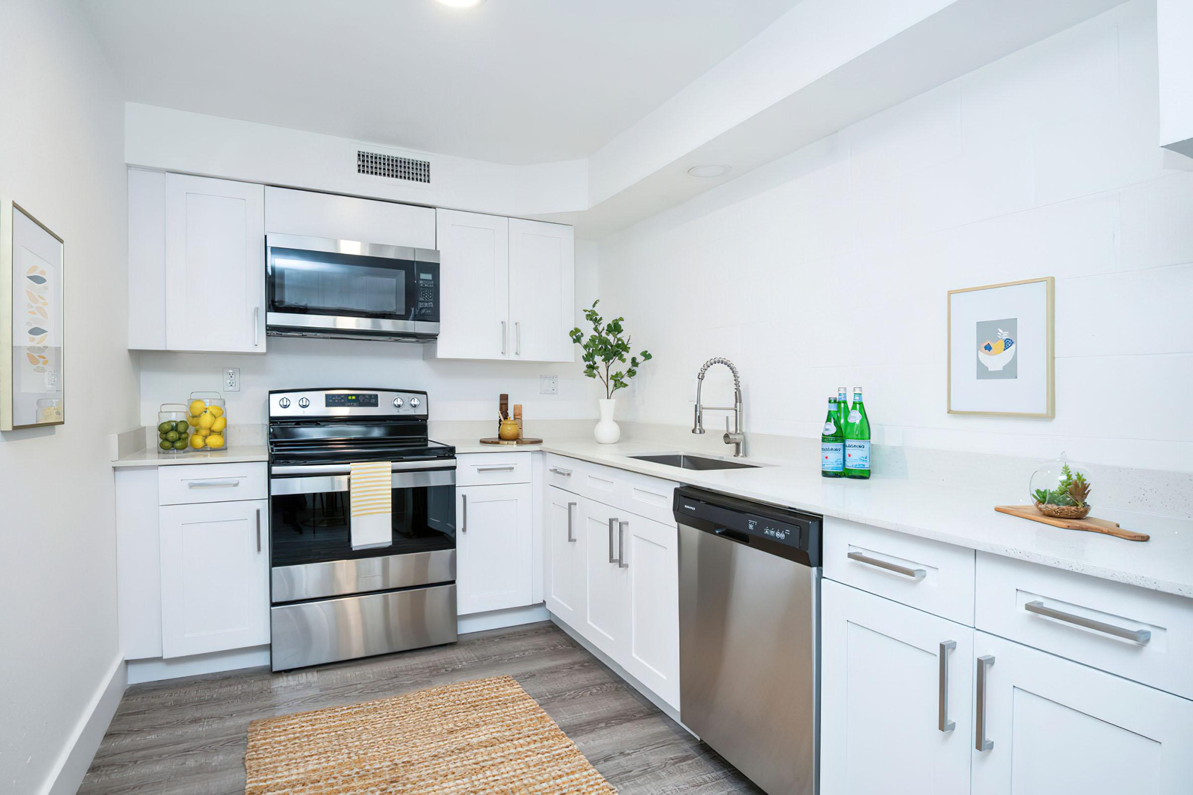 a modern kitchen with stainless steel appliances