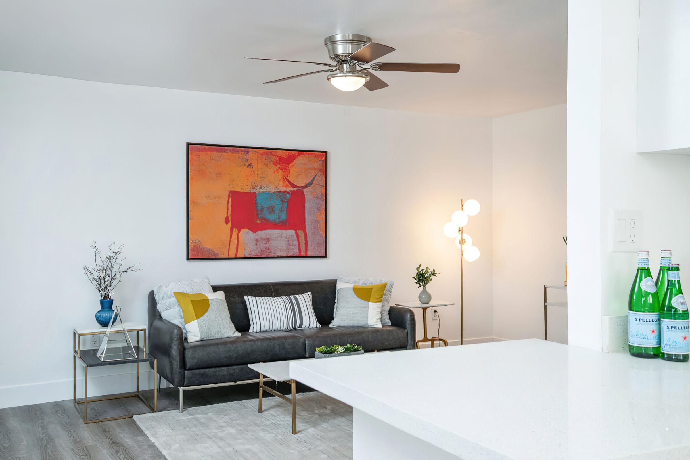 a living room filled with furniture and a fireplace