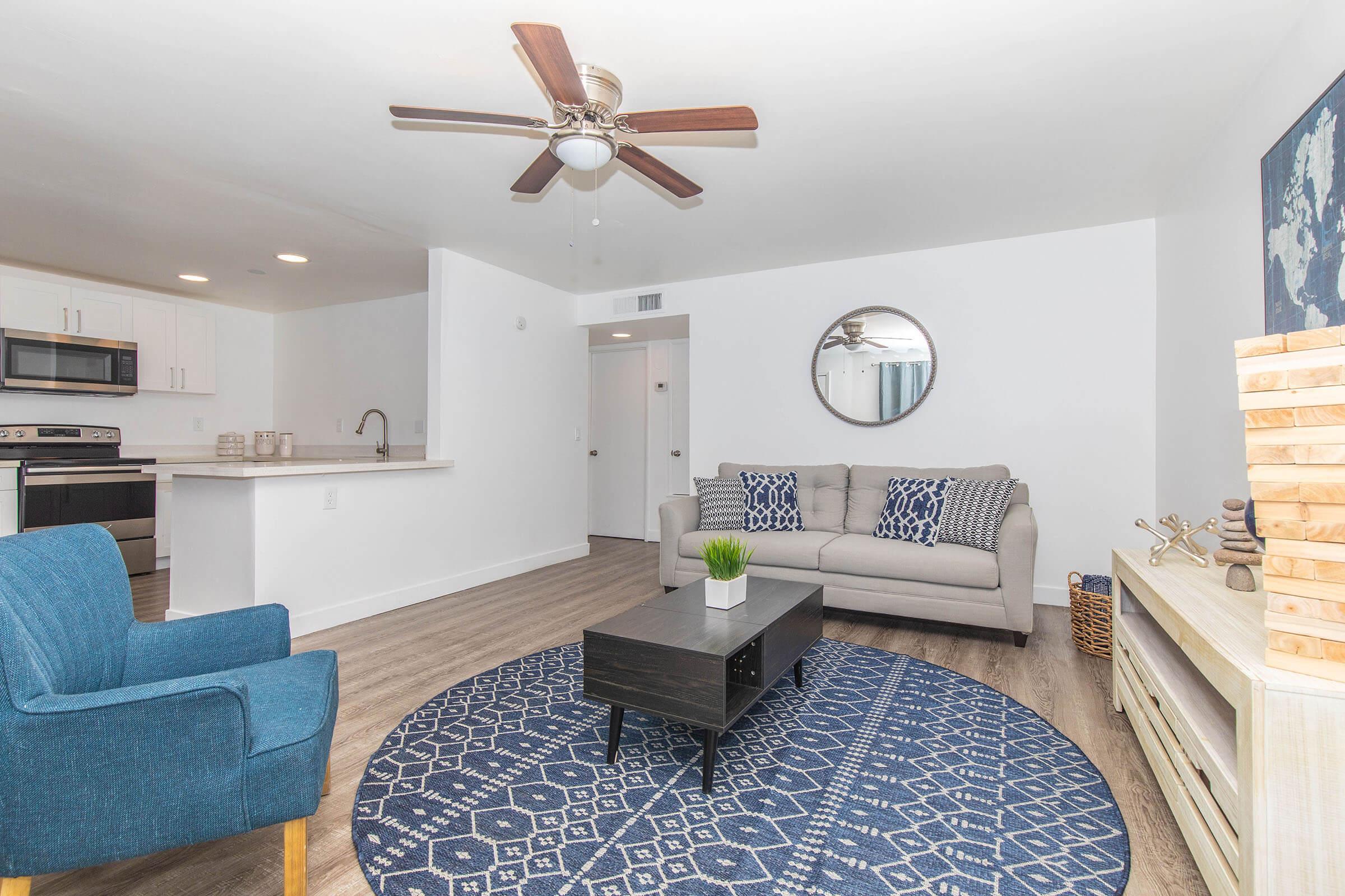 a living room filled with furniture and a rug