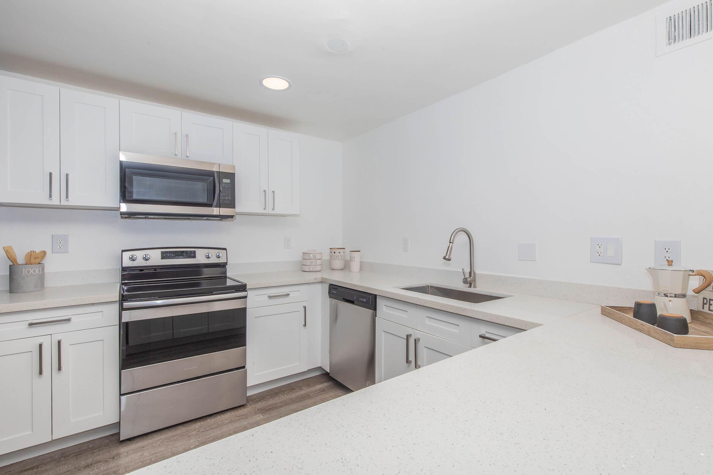 a kitchen with a stove and a sink