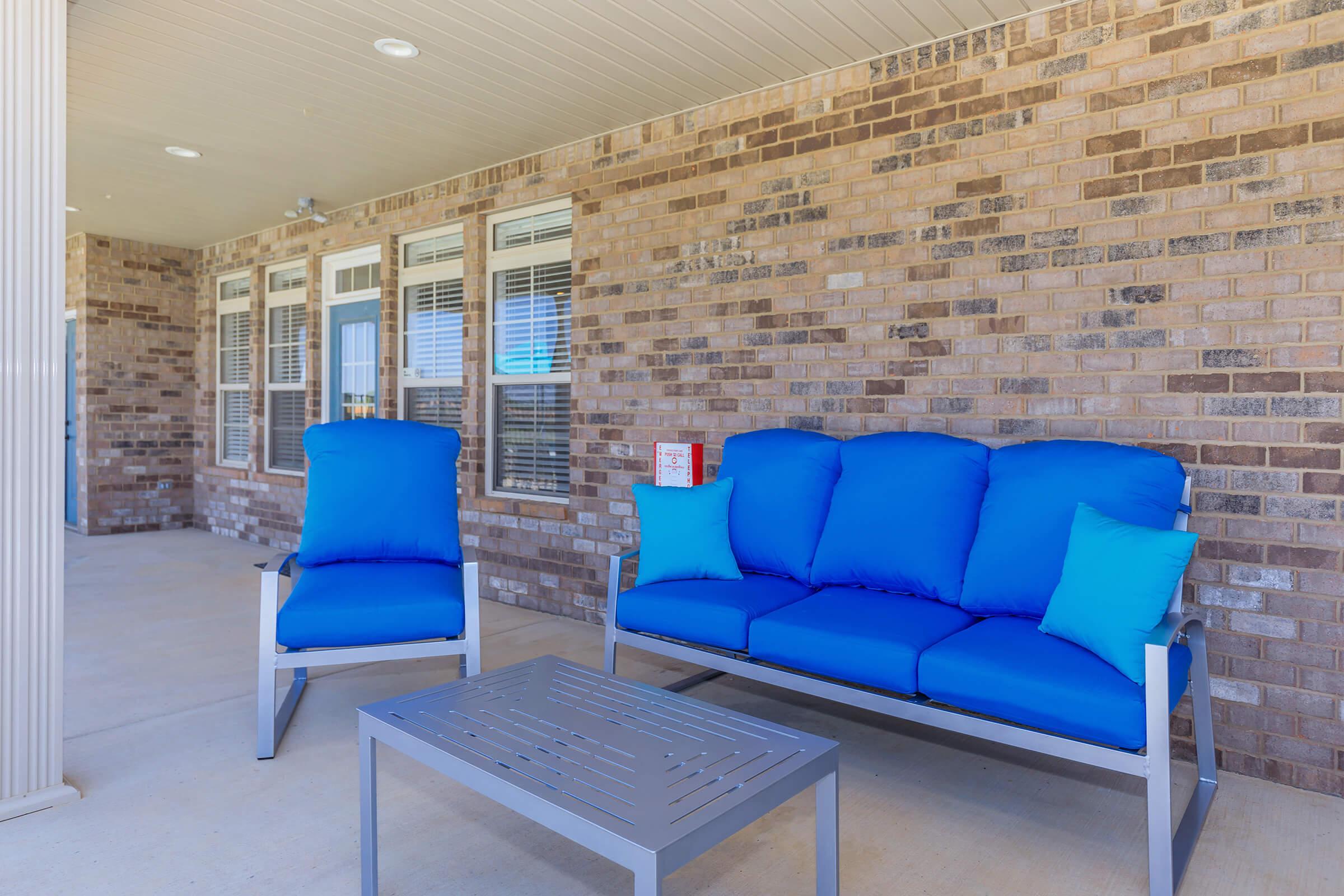 a living room with a blue chair