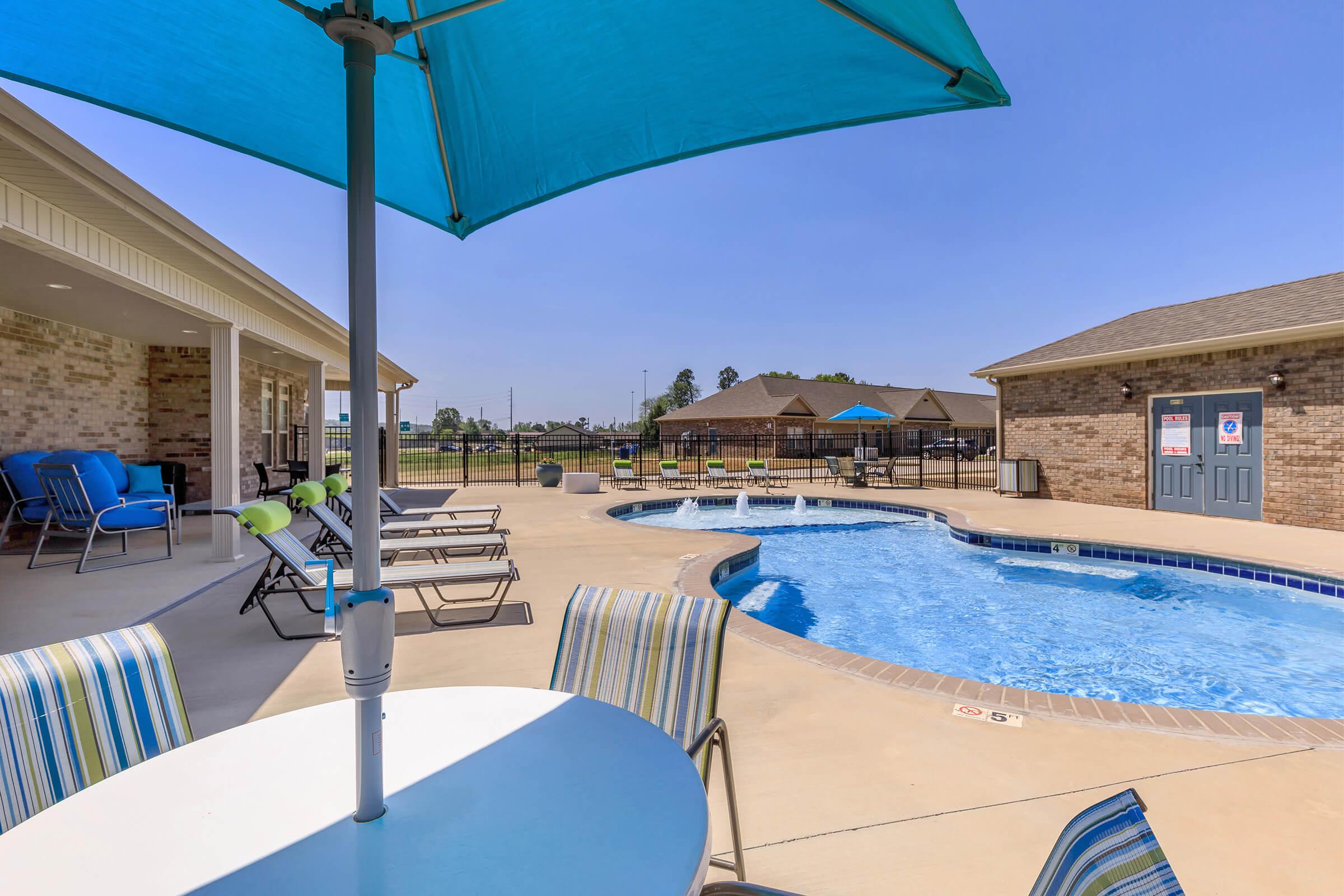 poolside table with umbrella