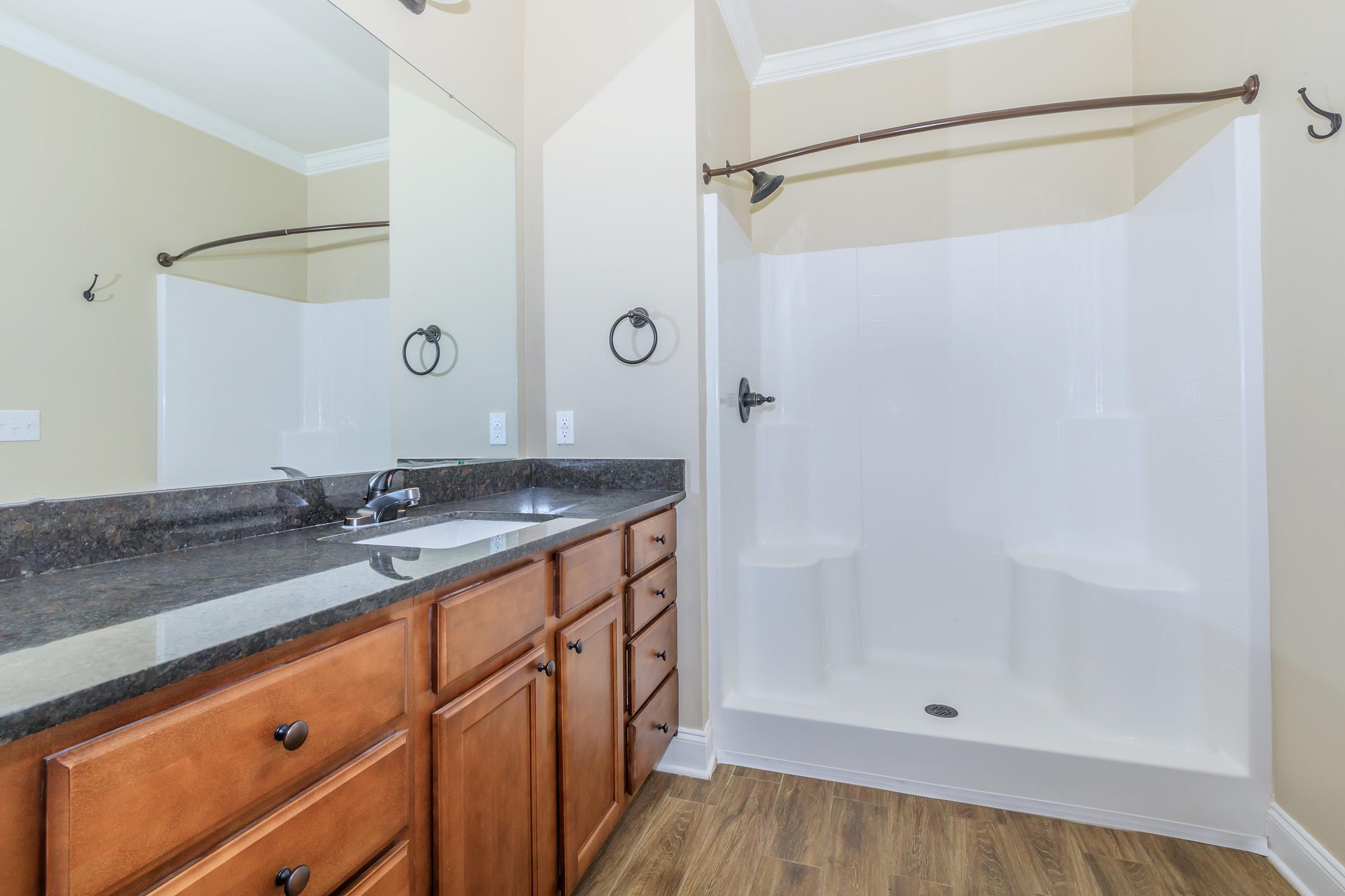 a kitchen with a sink and a mirror