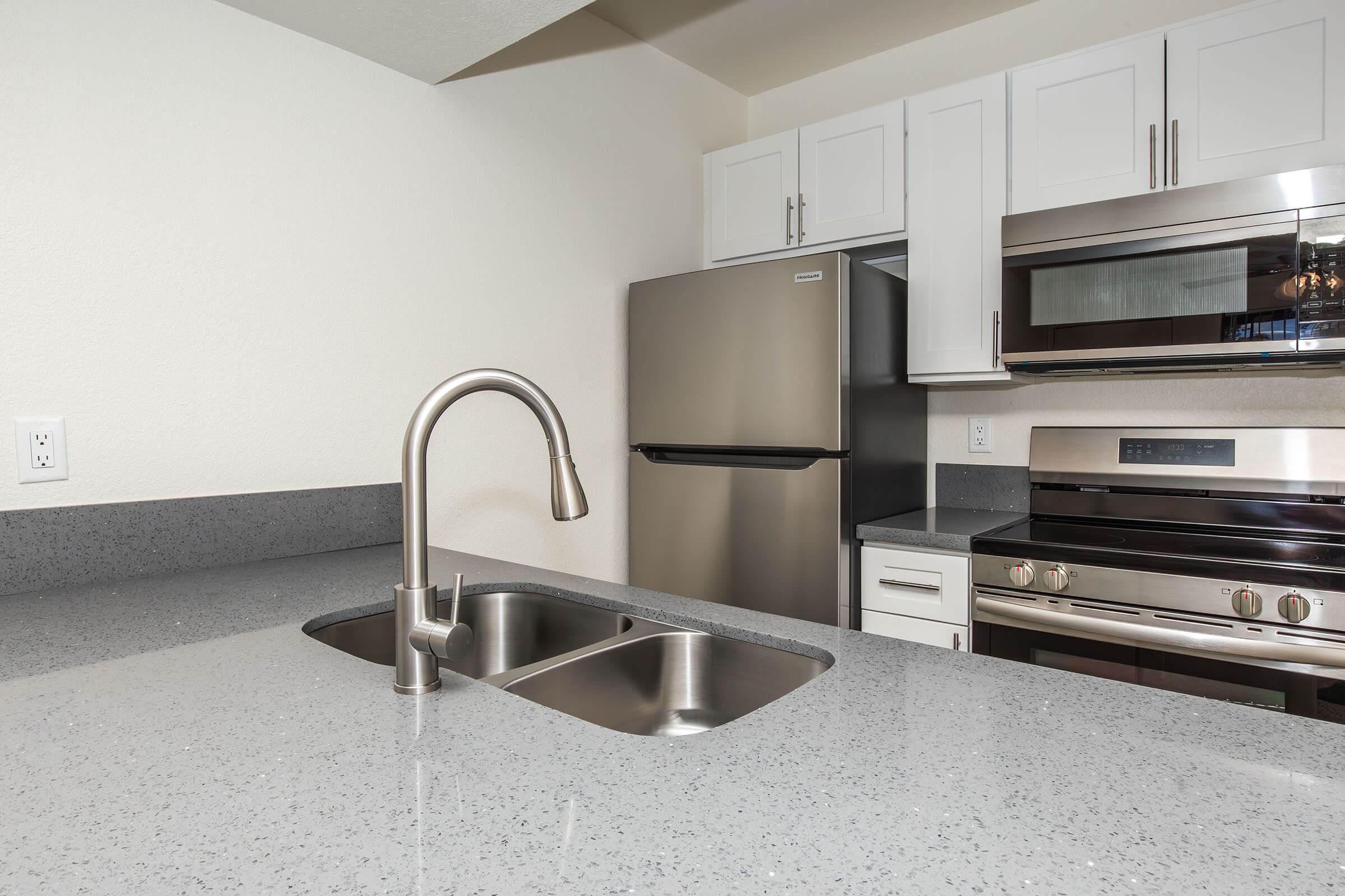 a kitchen with stainless steel appliances