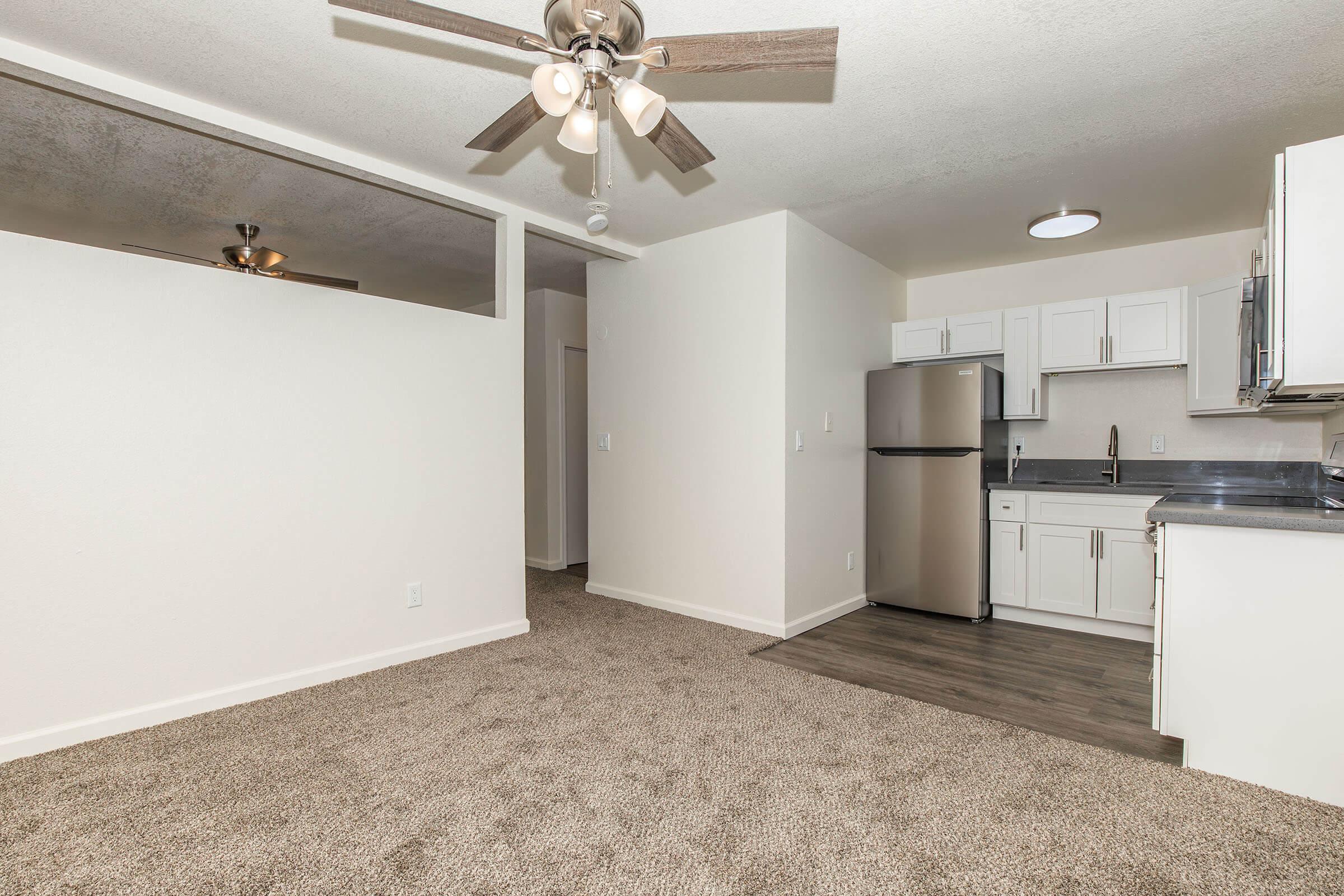 a kitchen with a sink and a refrigerator