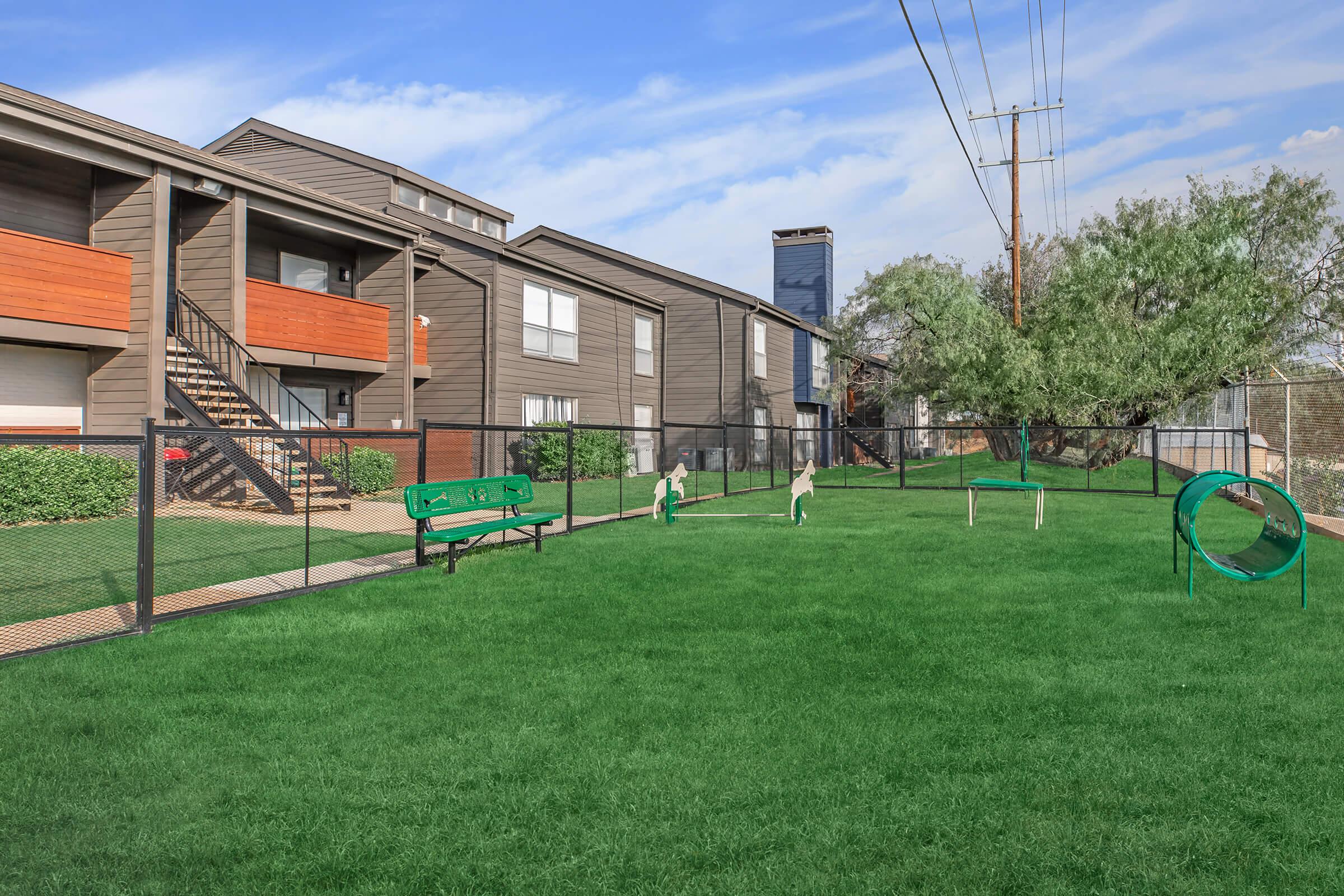 a green lawn in front of a building