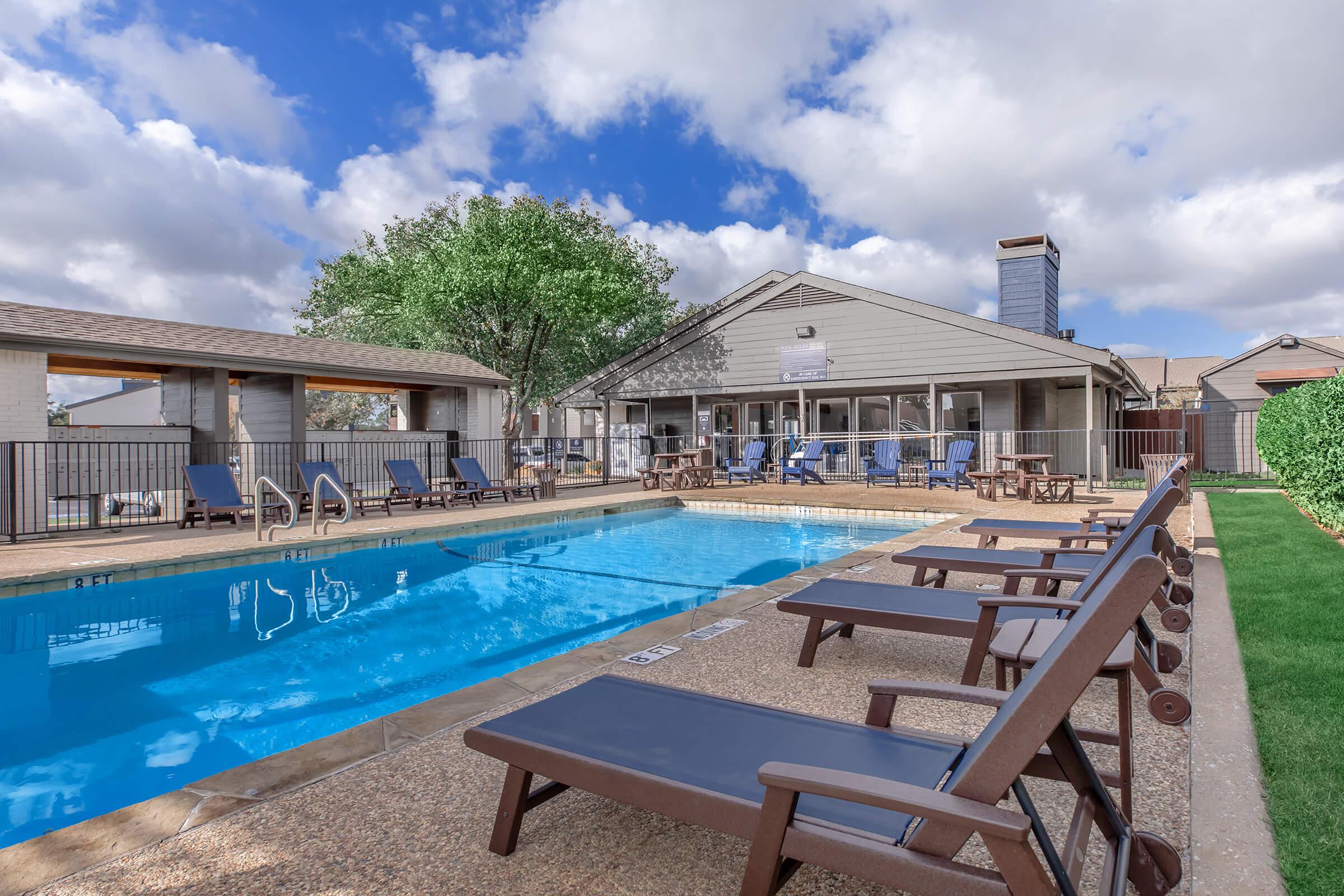 a chair sitting in front of a pool