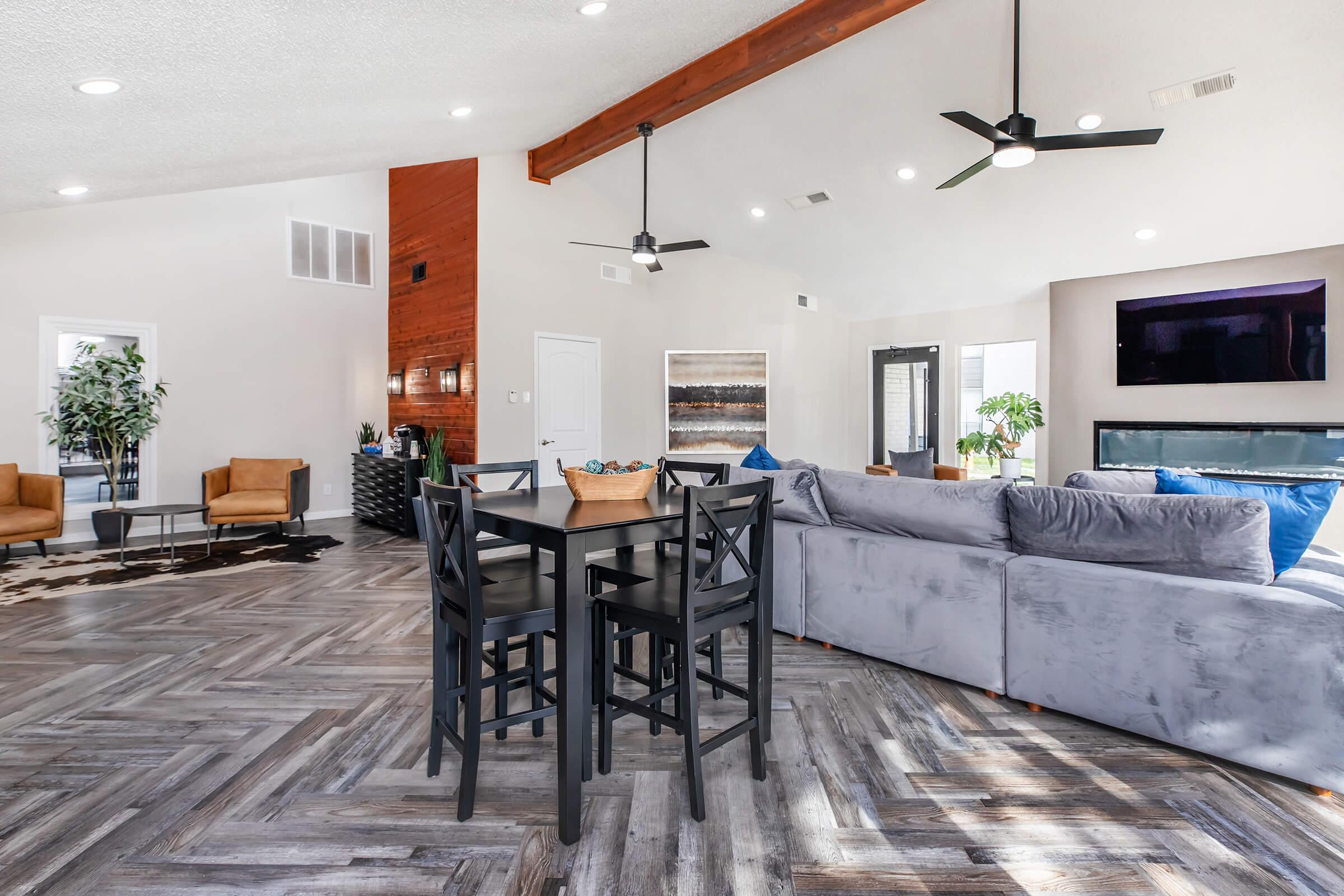 a living room filled with furniture and a table