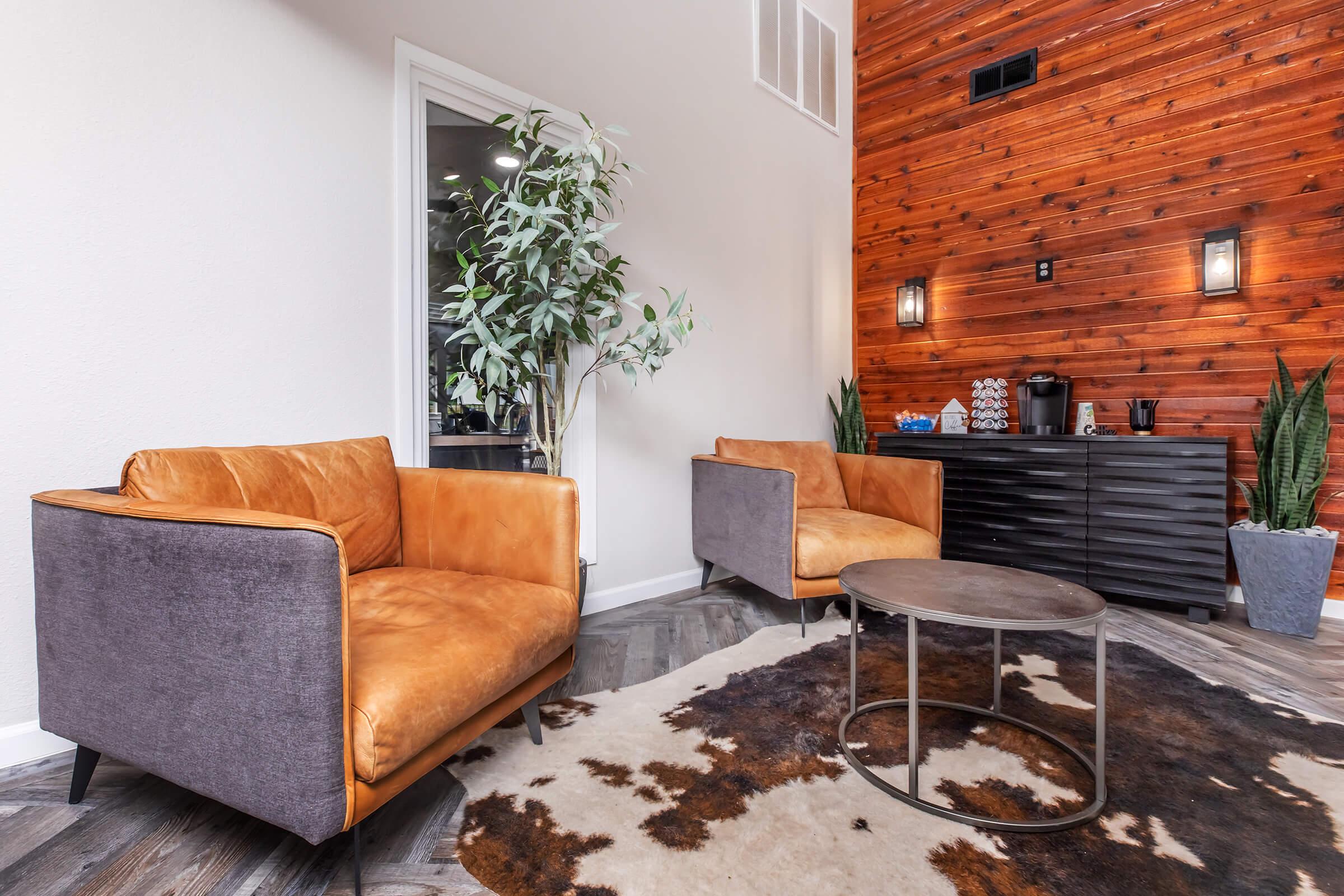 a living room filled with furniture and a fireplace