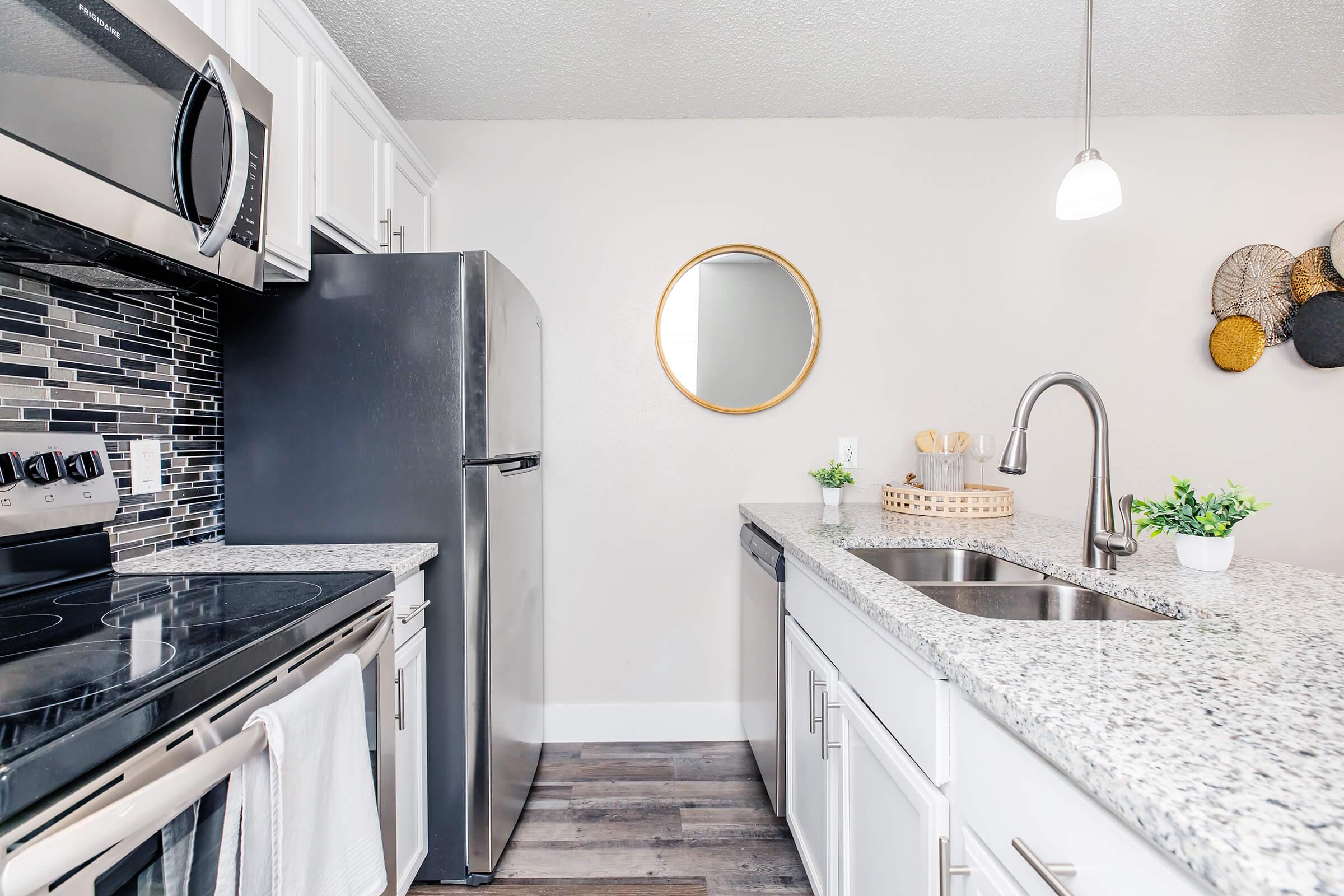 a modern kitchen with stainless steel appliances