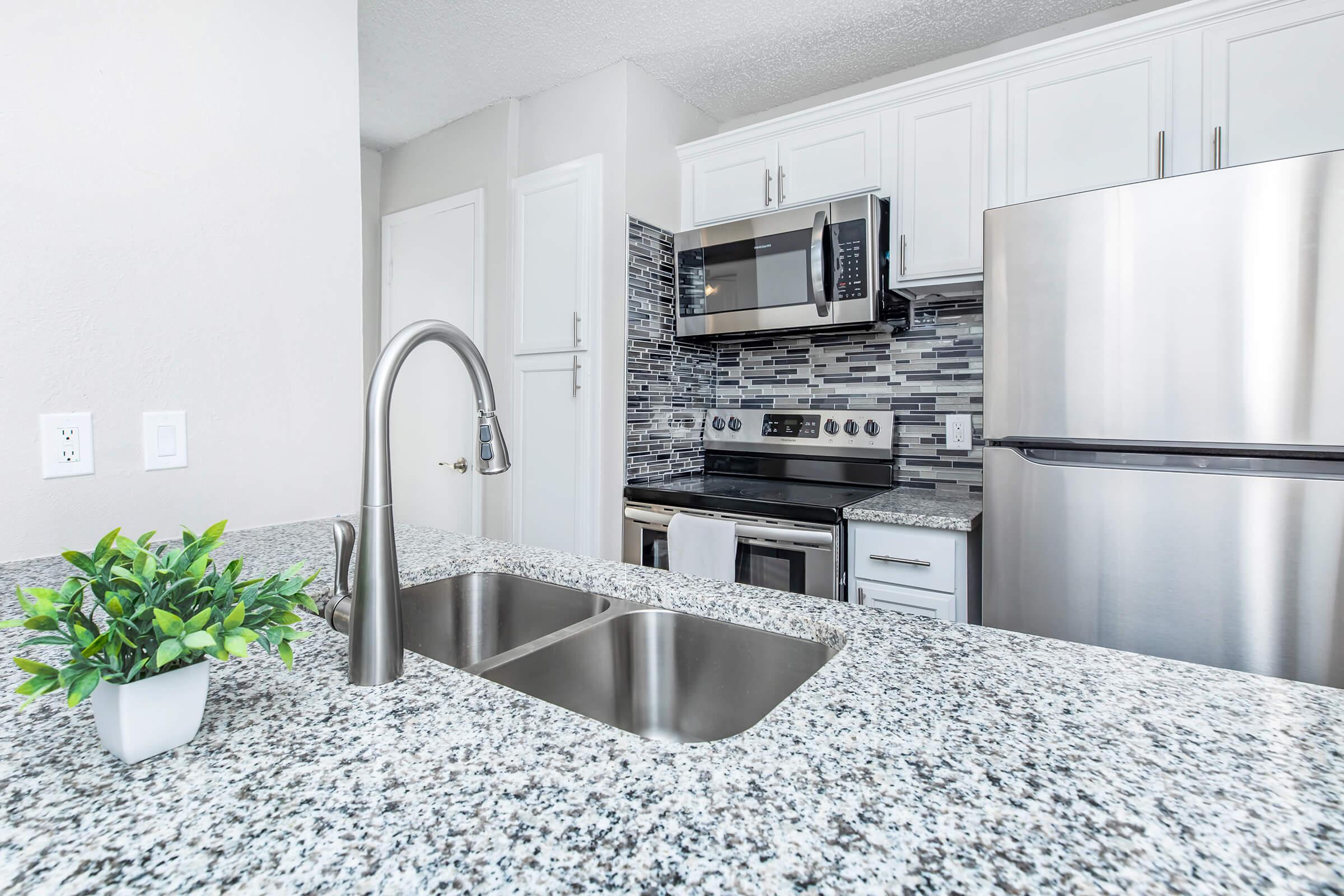 a kitchen with a sink and a window