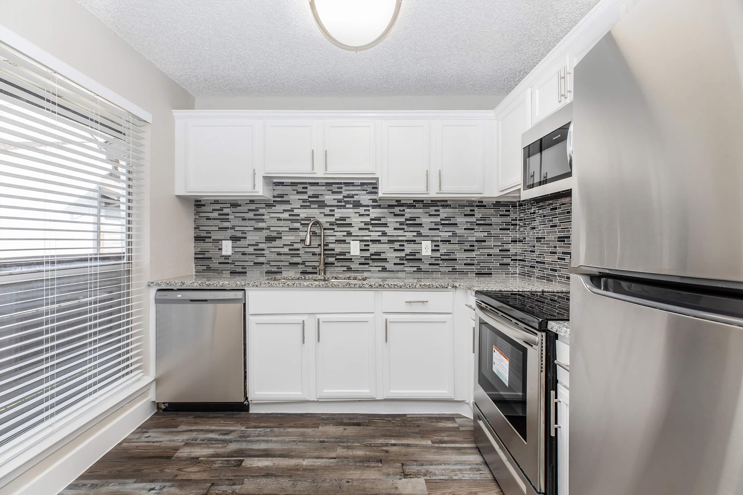 a kitchen with a stove top oven sitting inside of a refrigerator