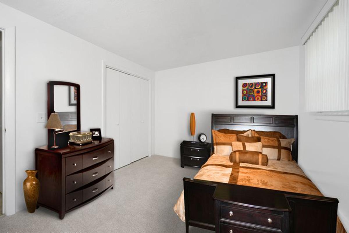 a living room filled with furniture and a flat screen tv