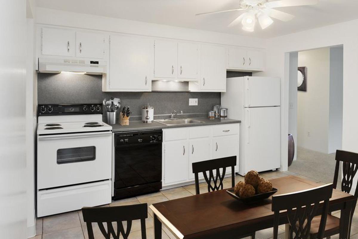 a kitchen with a dining room table
