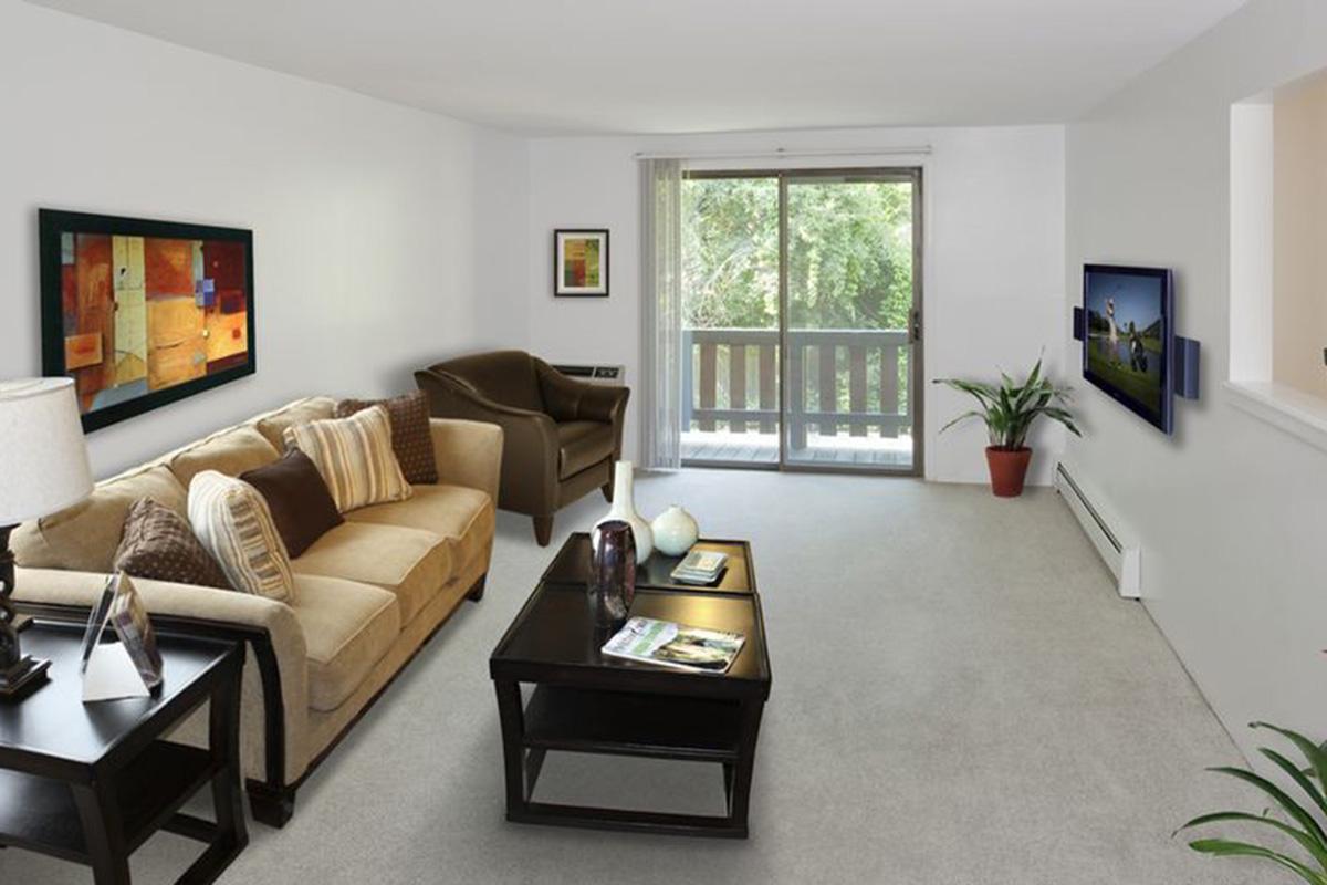 a living room filled with furniture and a fire place