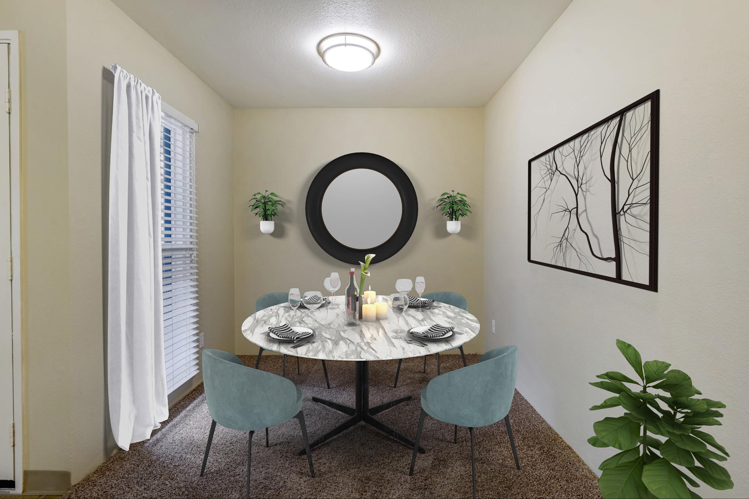 A cozy dining area featuring a round marble table set for six with elegant dinnerware.