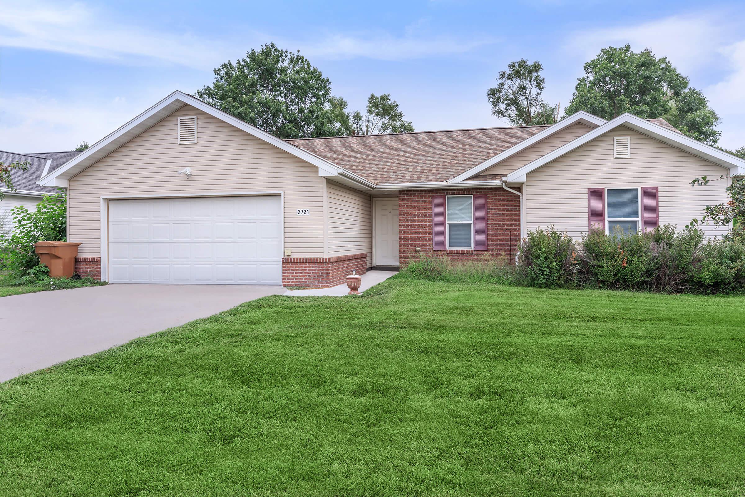 a large lawn in front of a house