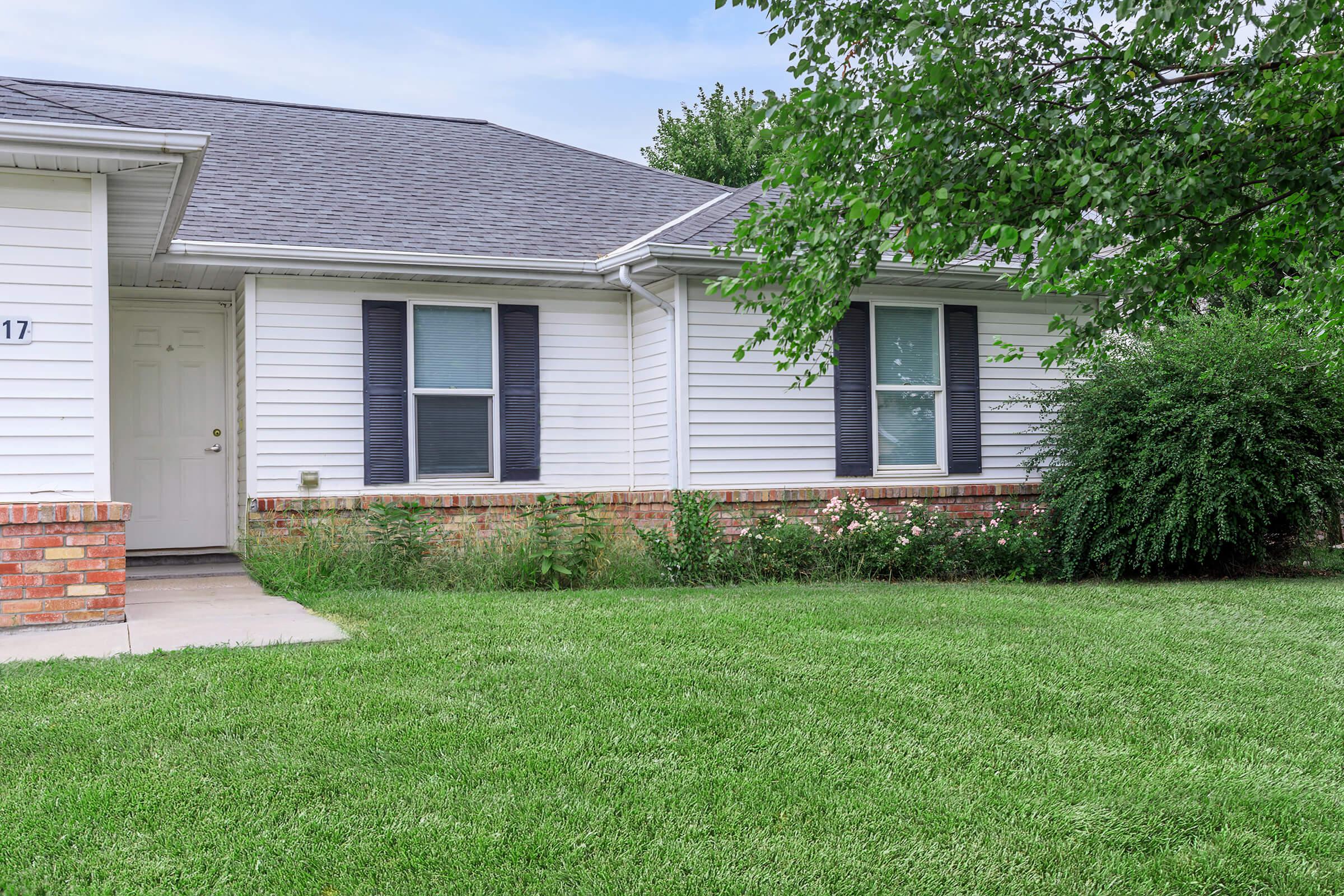 a large lawn in front of a house