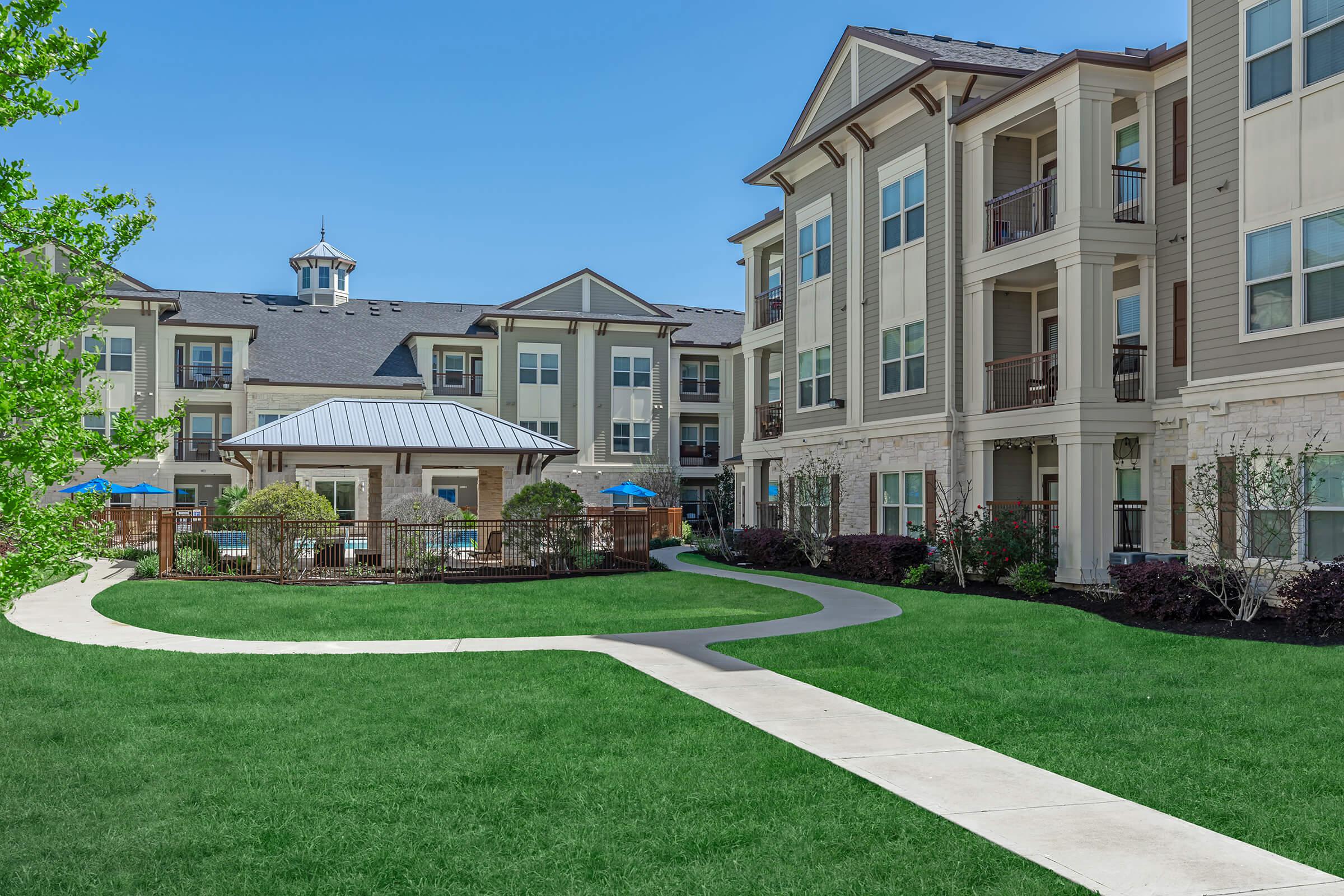 a large lawn in front of a building