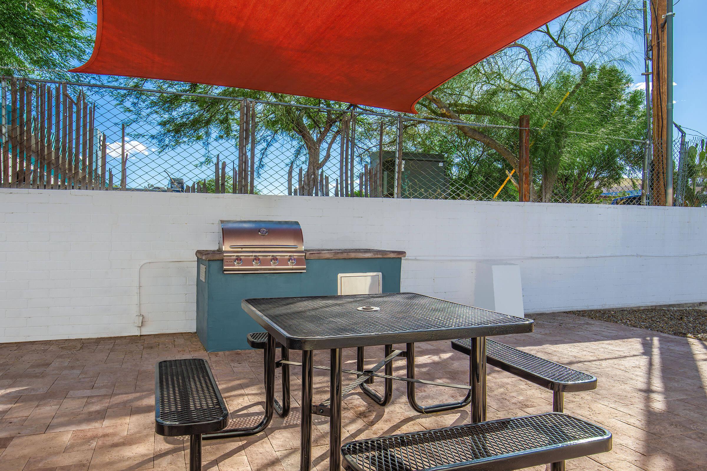 a wooden bench sitting on top of a picnic table