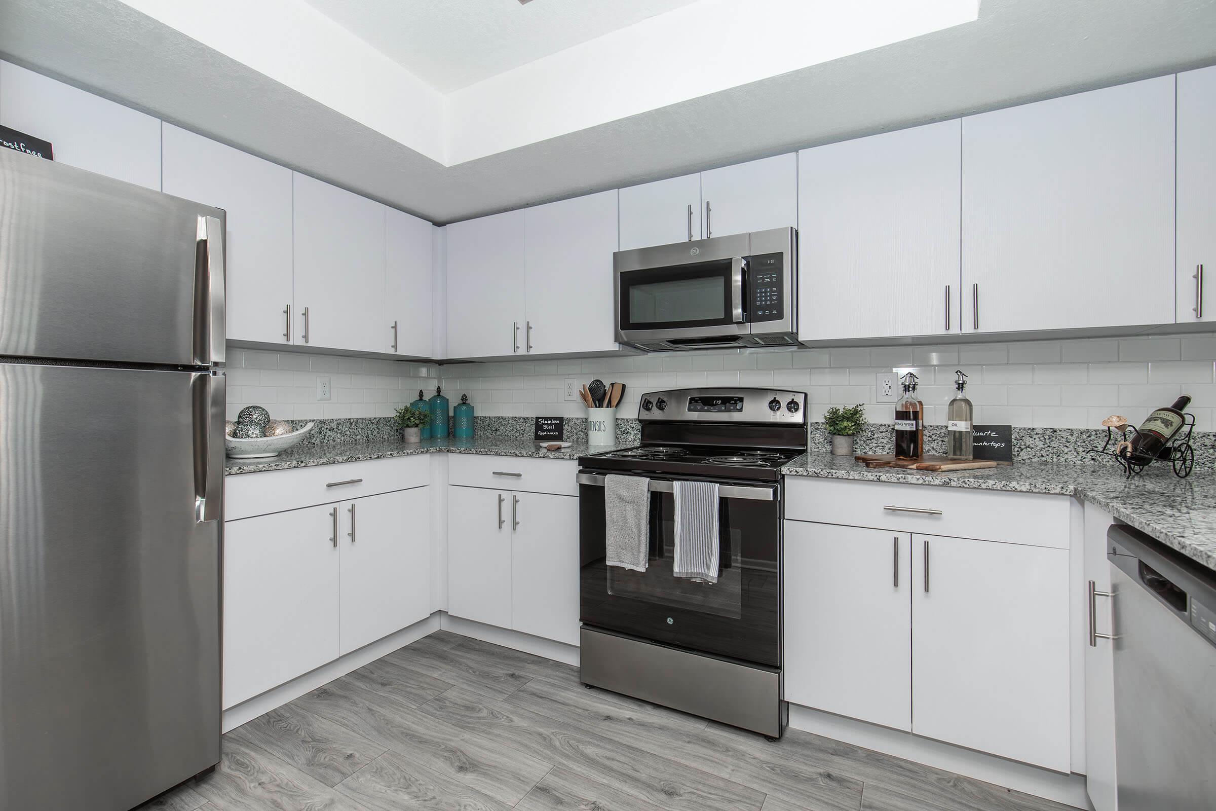 a large kitchen with stainless steel appliances