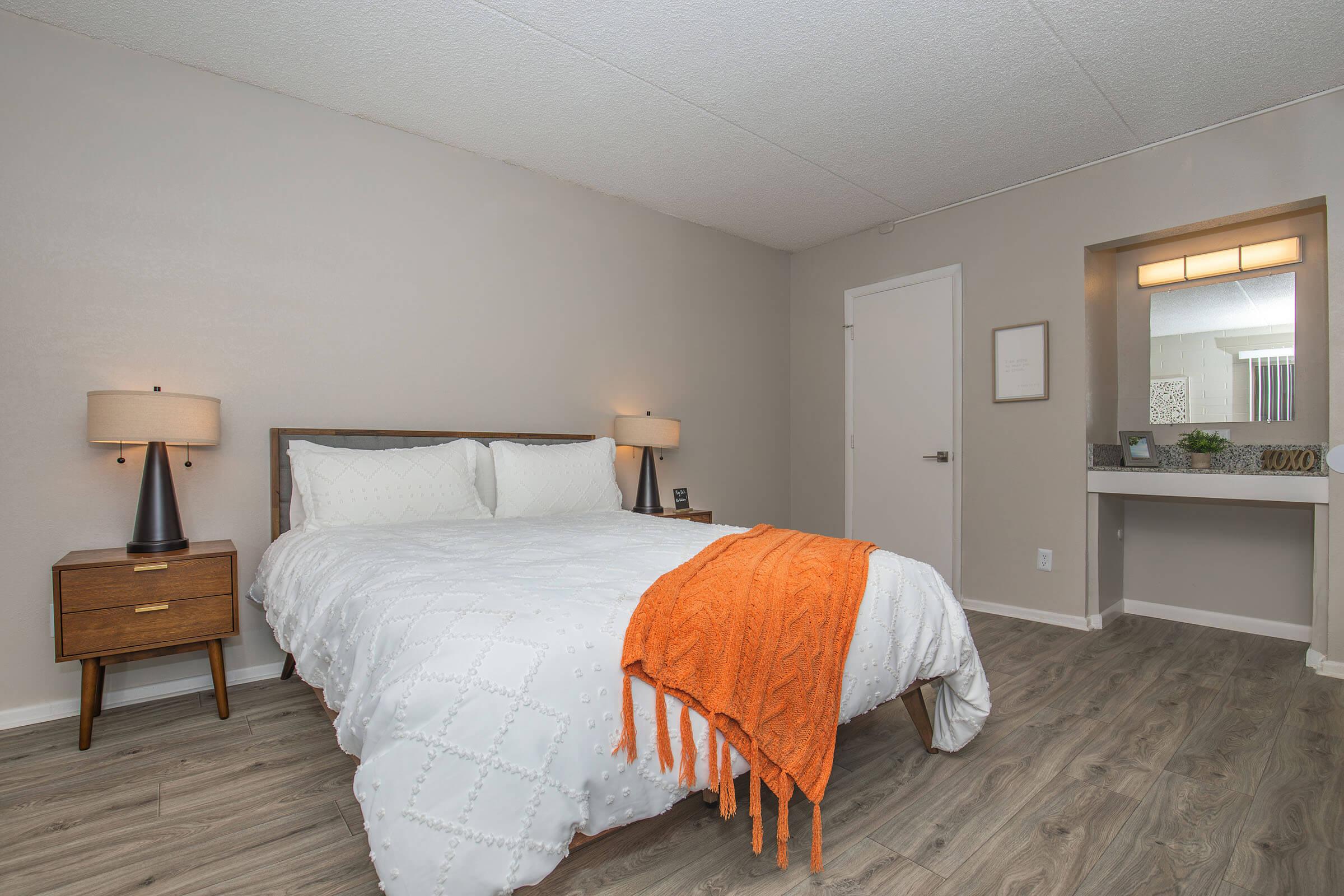 a bedroom with a large bed in a hotel room