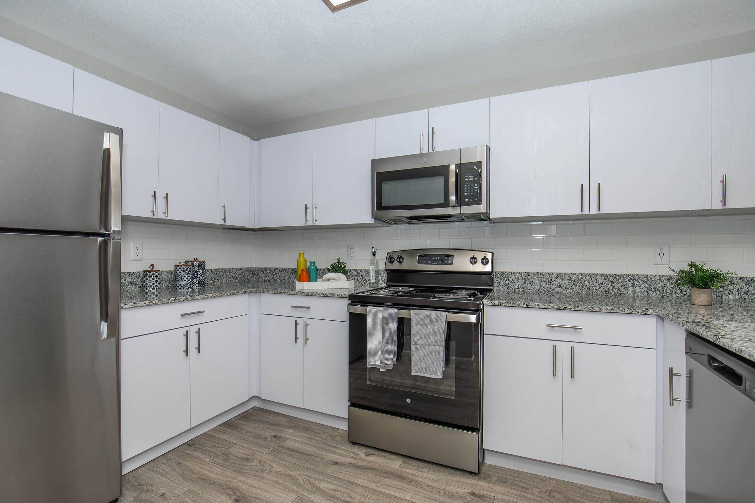 a large kitchen with stainless steel appliances