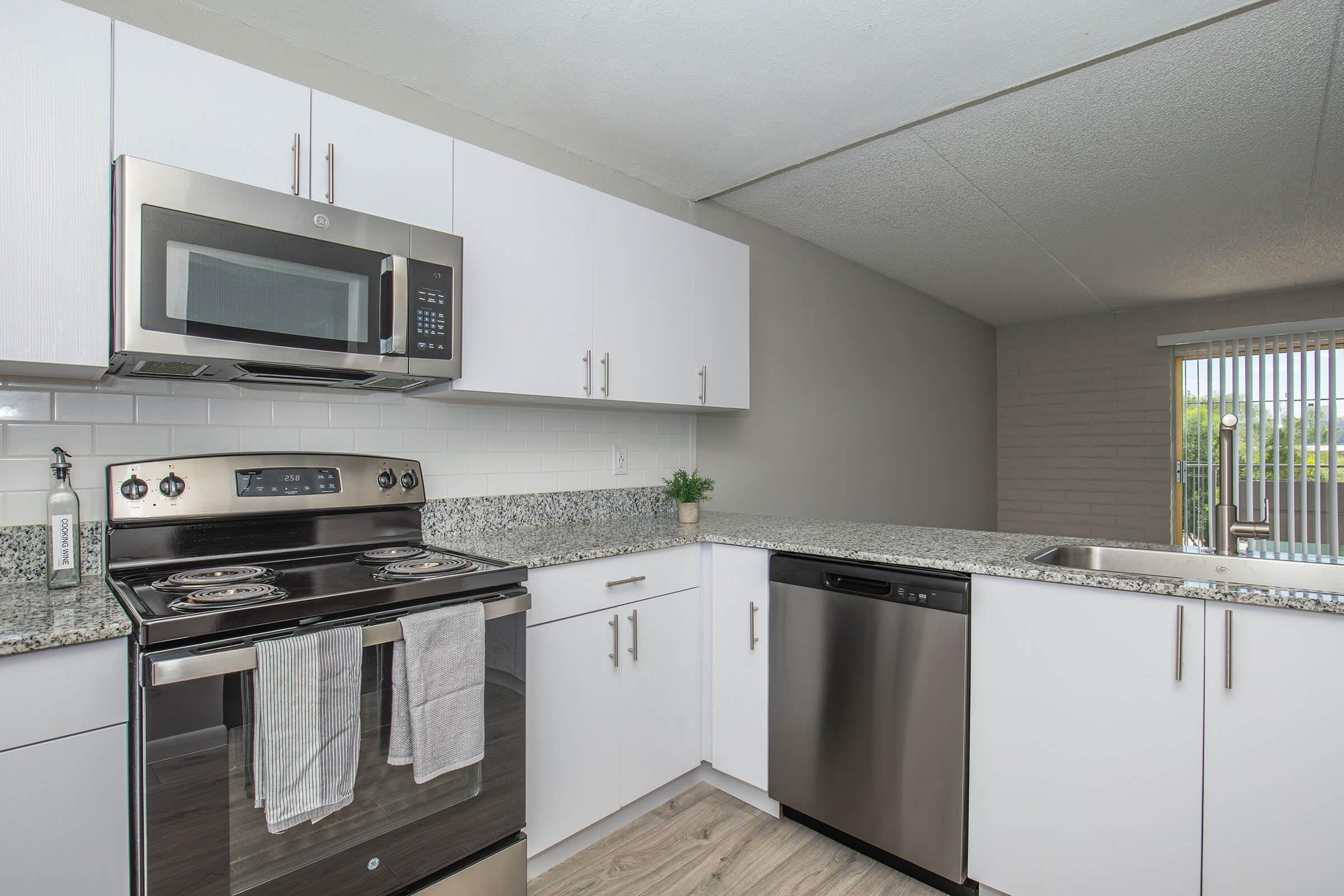 a kitchen with a stove top oven