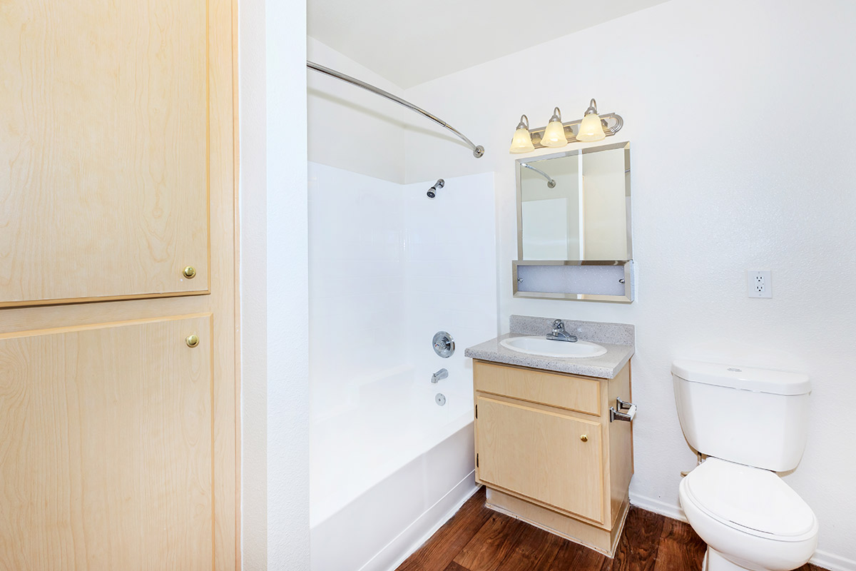 a white sink sitting next to a door