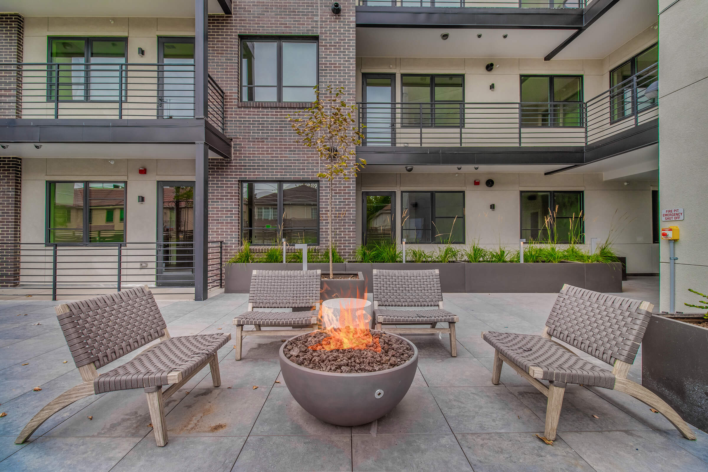 a chair sitting in front of a brick building