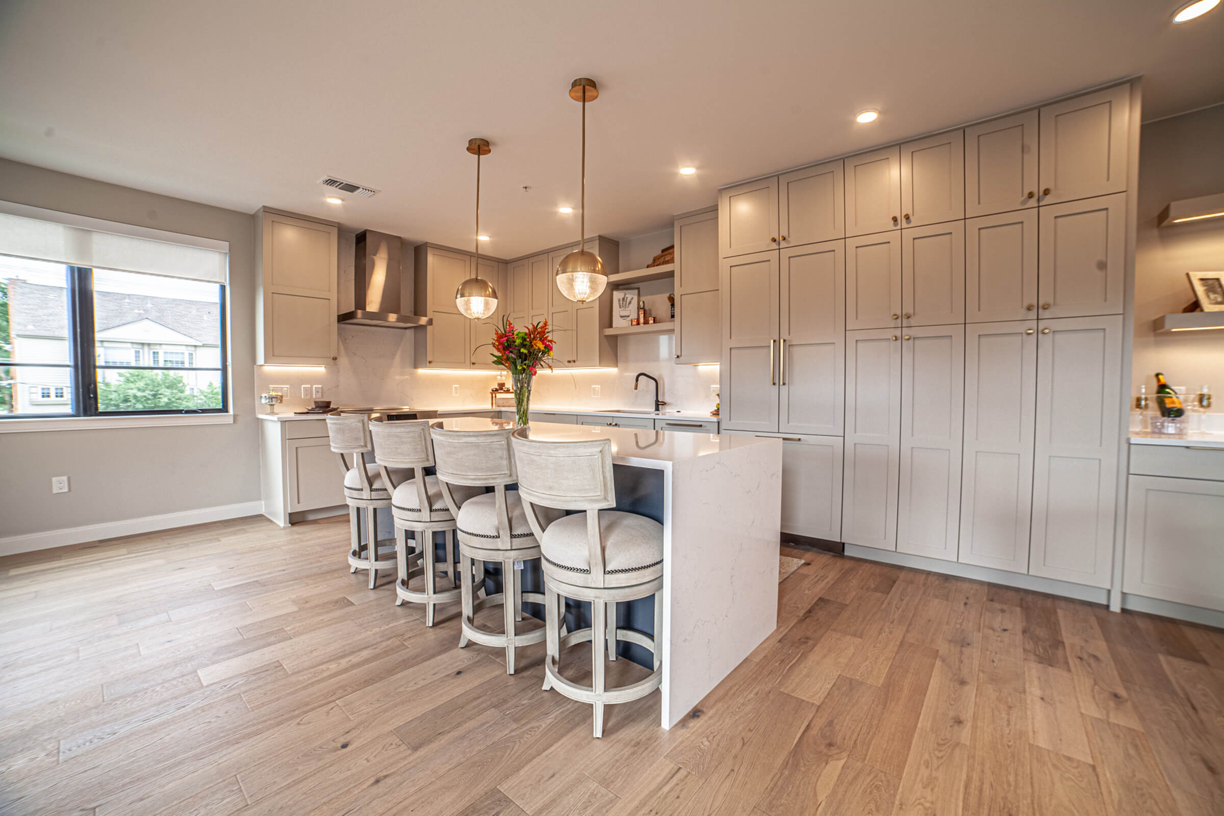 a large kitchen with an island in the middle of a room