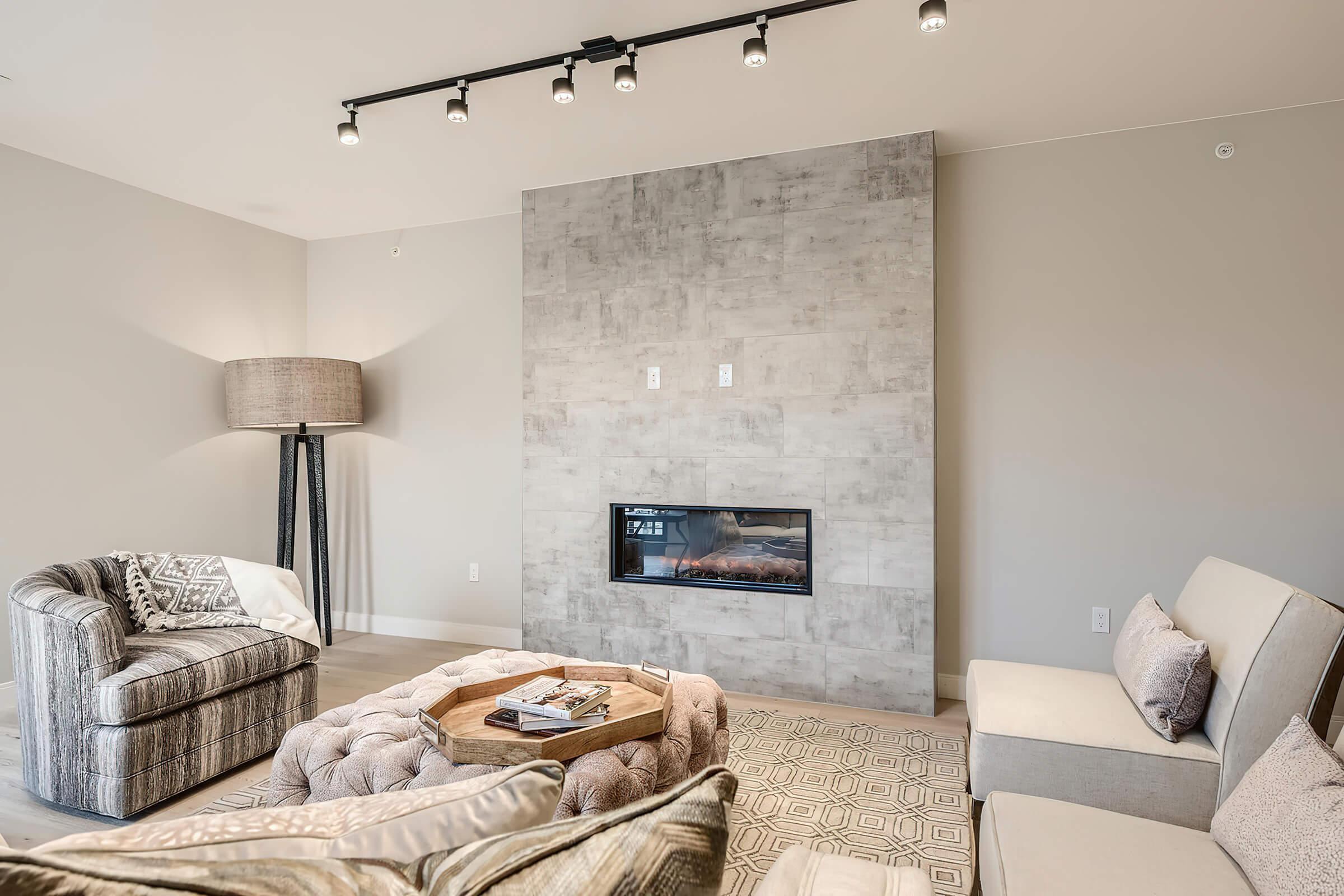 a living room with a bed and a fireplace