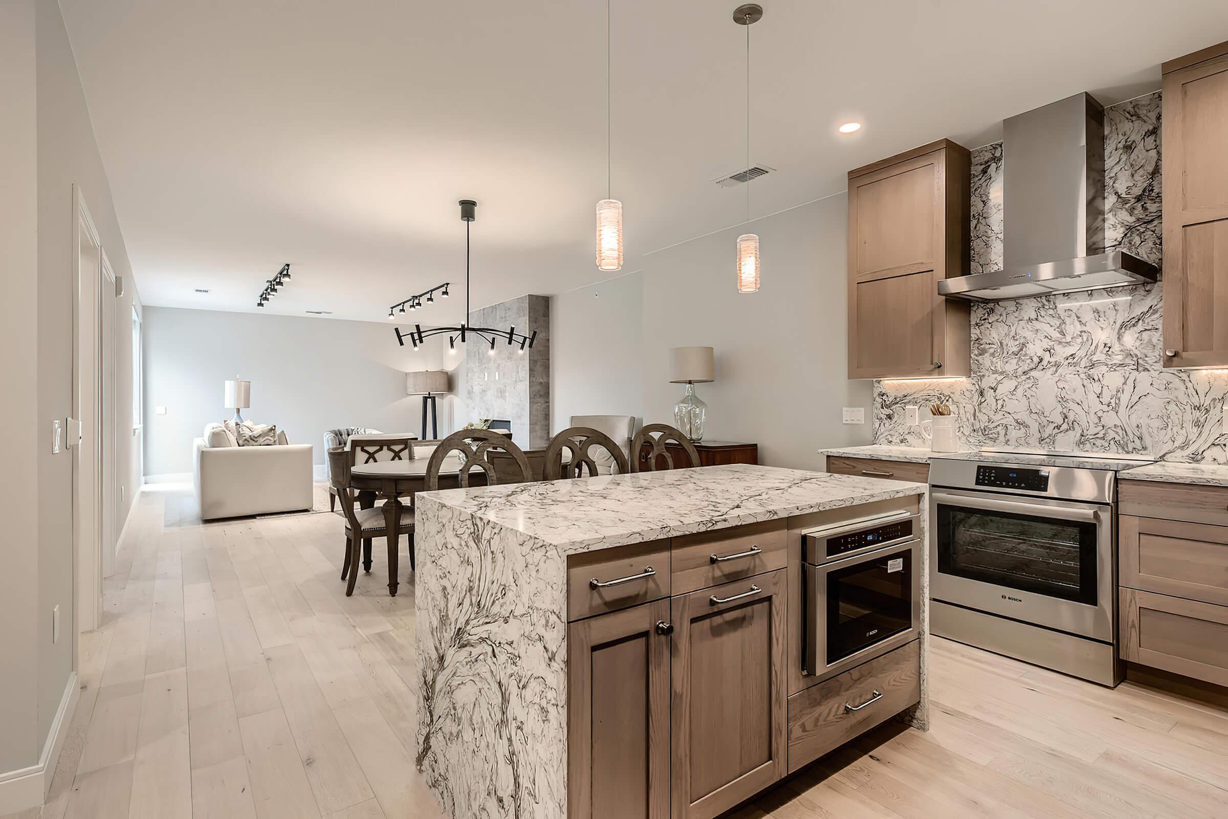 a kitchen with a stove top oven sitting inside of a room