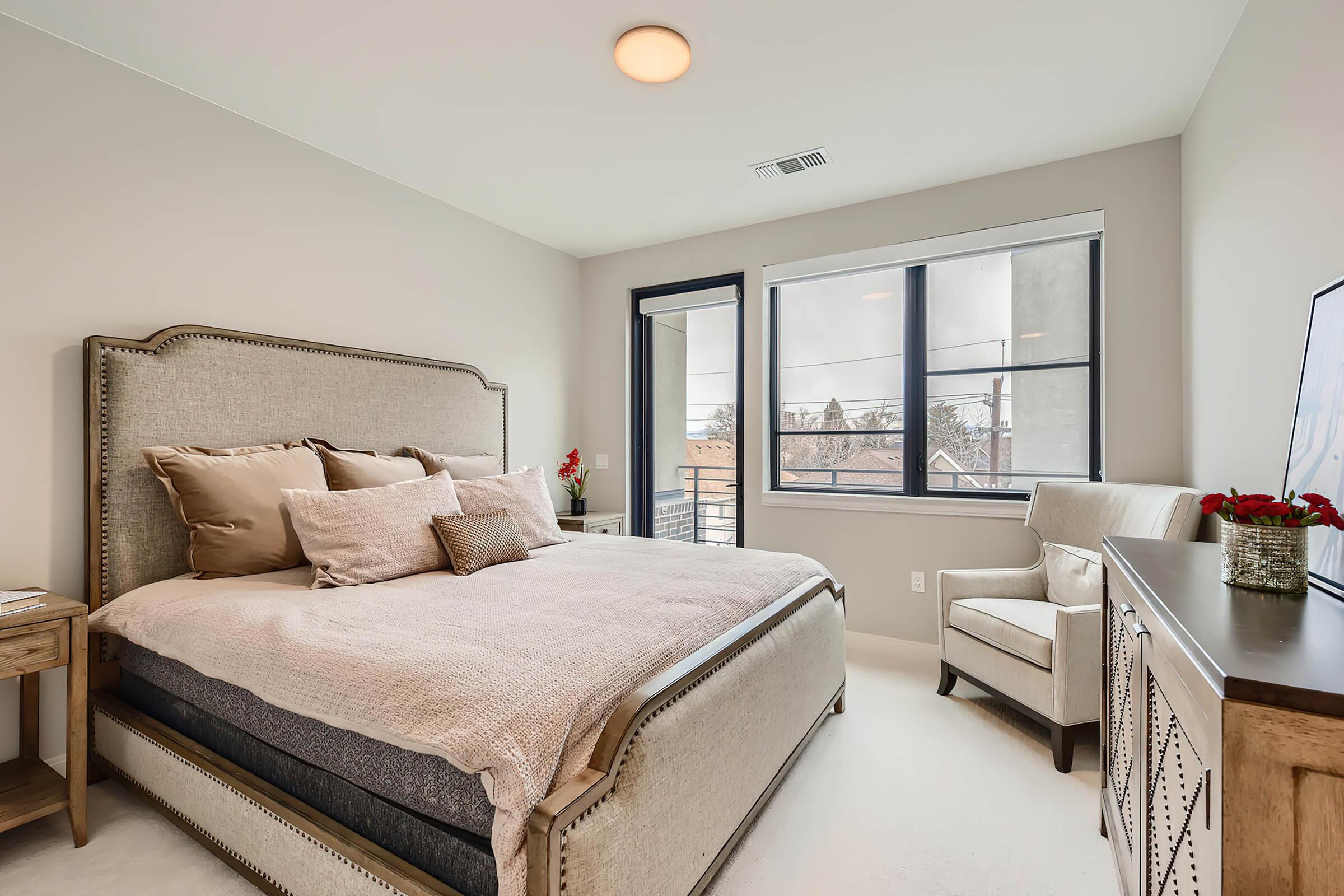 a bedroom with a large bed in a hotel room