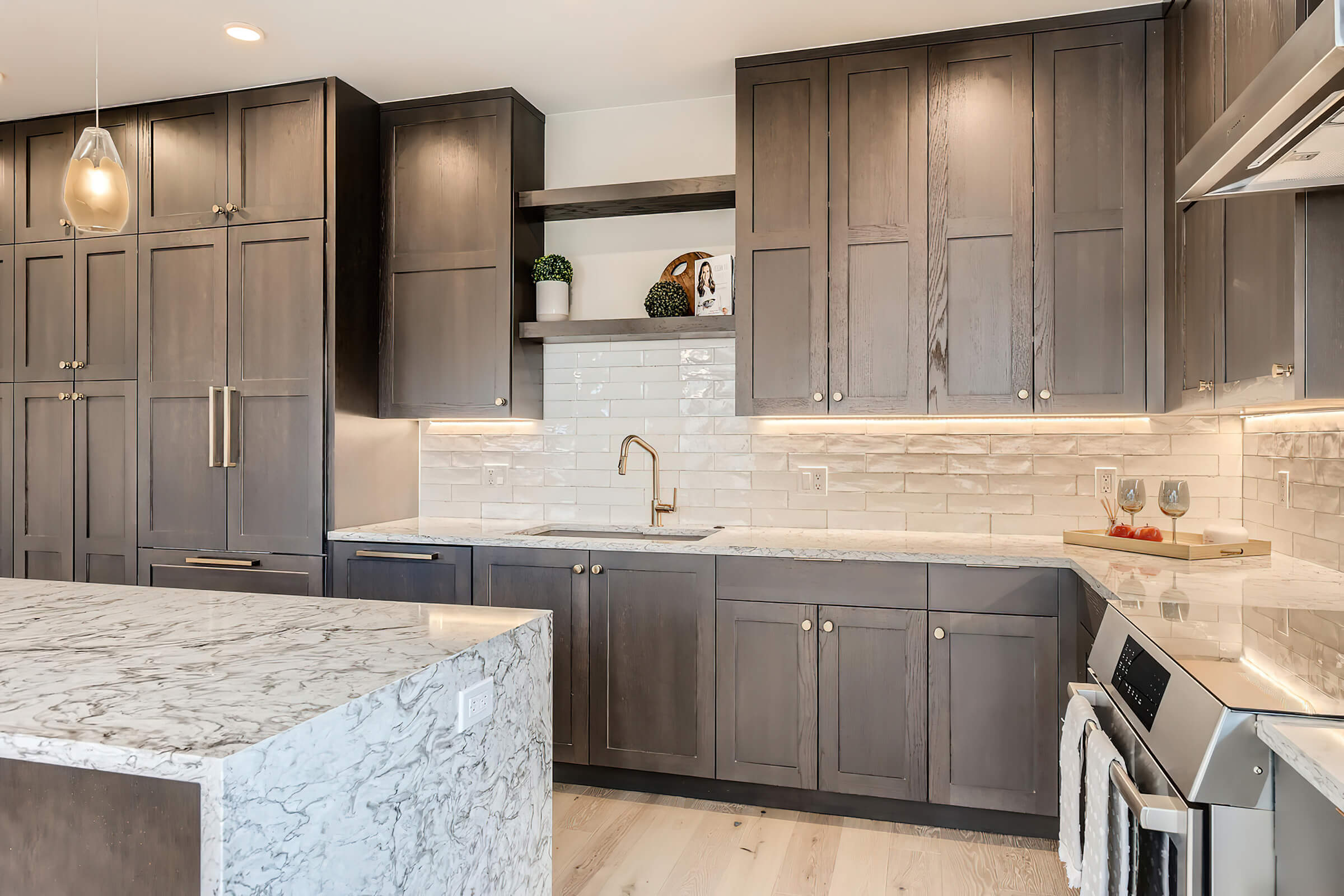 a large kitchen with stainless steel appliances