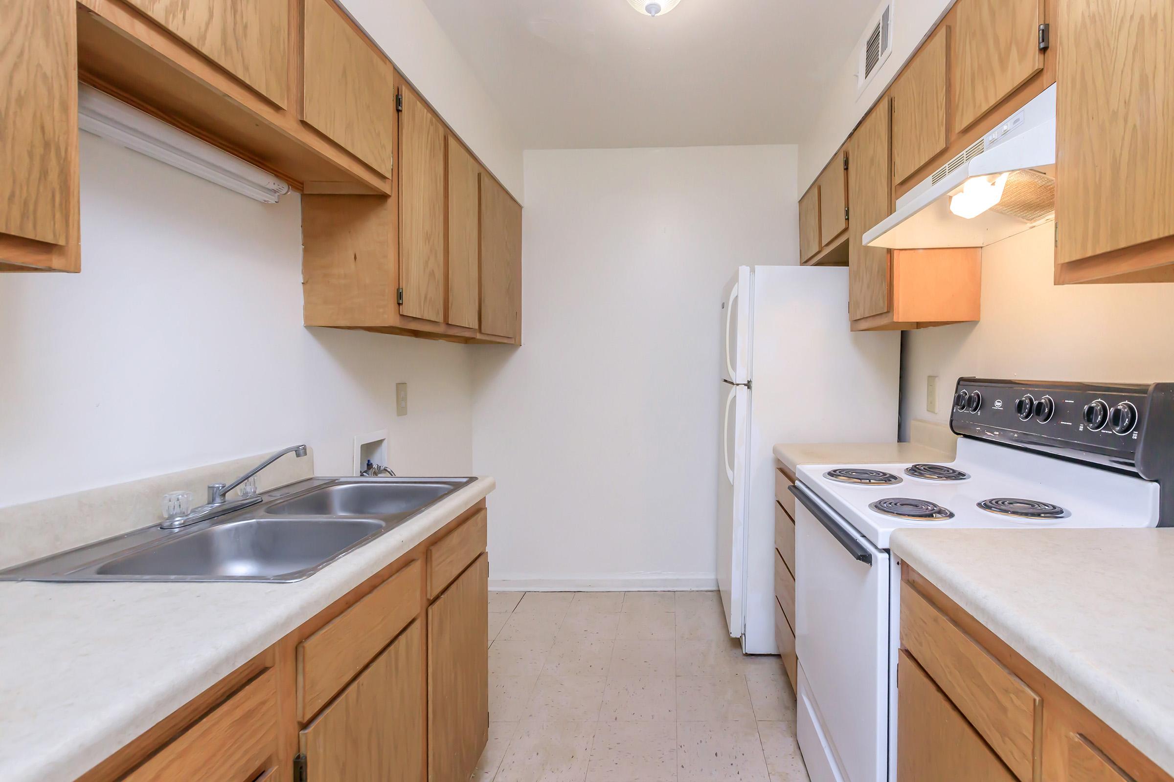 a kitchen with a stove and a sink