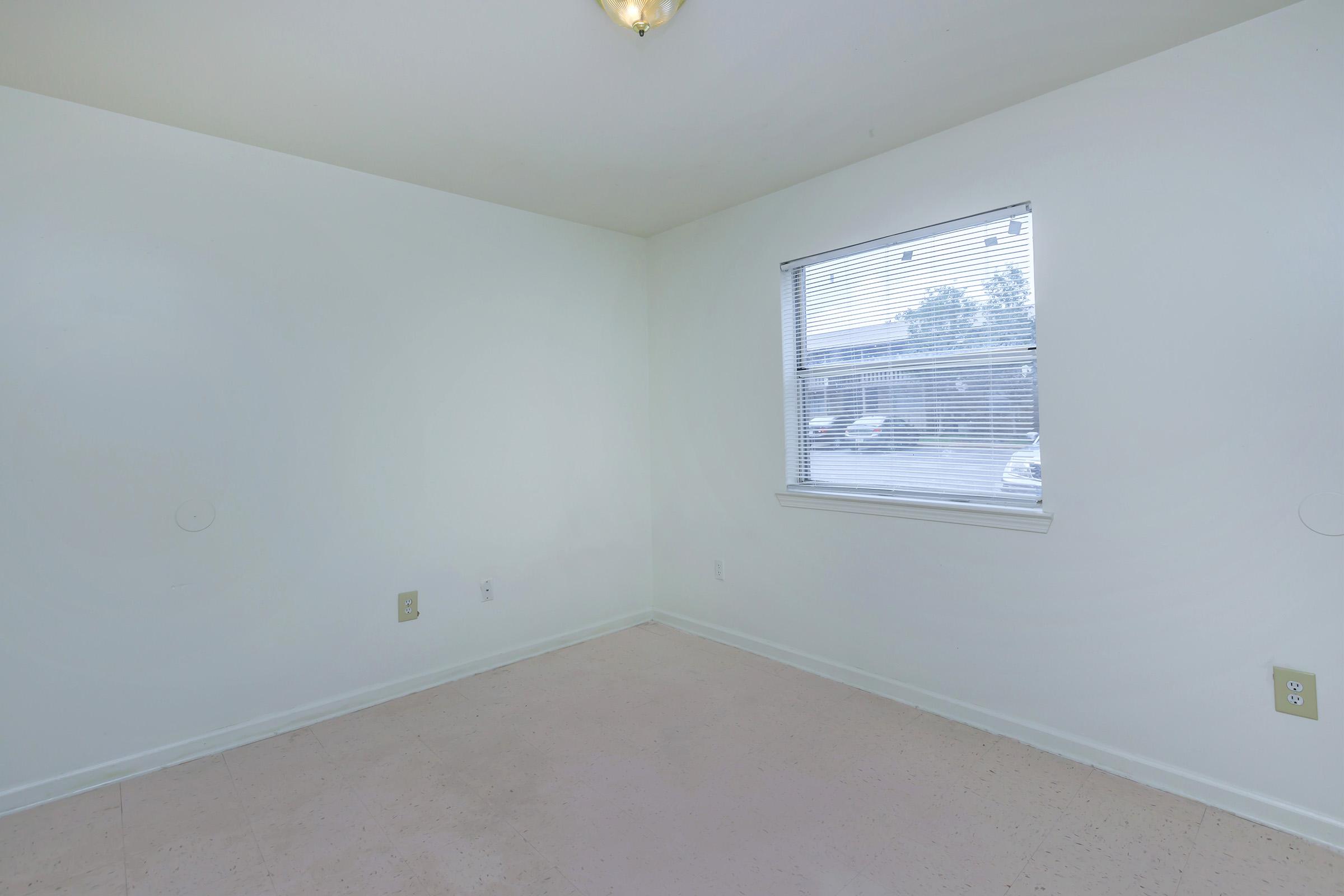 a room with a sink and a window