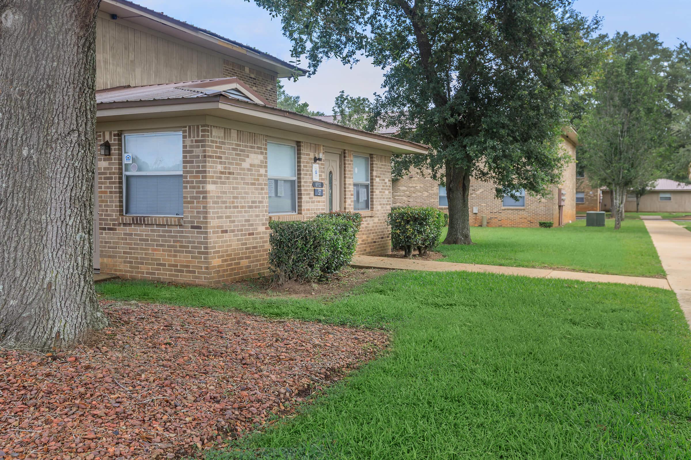 a large lawn in front of a house